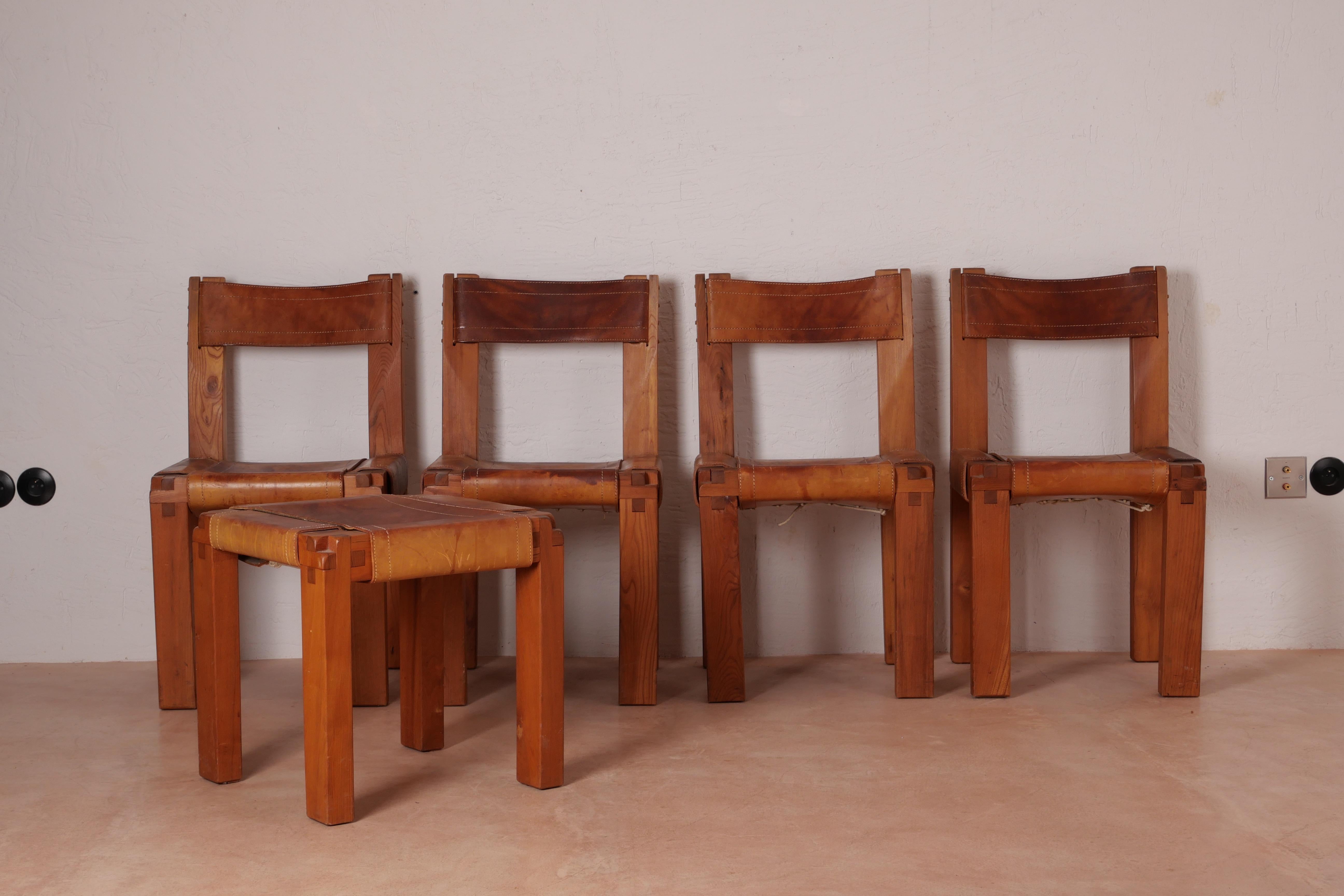 Set of four dining chairs, iconic model S11 in solid elmwood with cognac original saddle leather seating and back, designed by French designer Pierre Chapo in France. The stool is not included in the set. Original invoice 1973 available for the