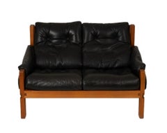 Pierre Chapo. S22 two-seater sofa, in elm and black leather. 1970