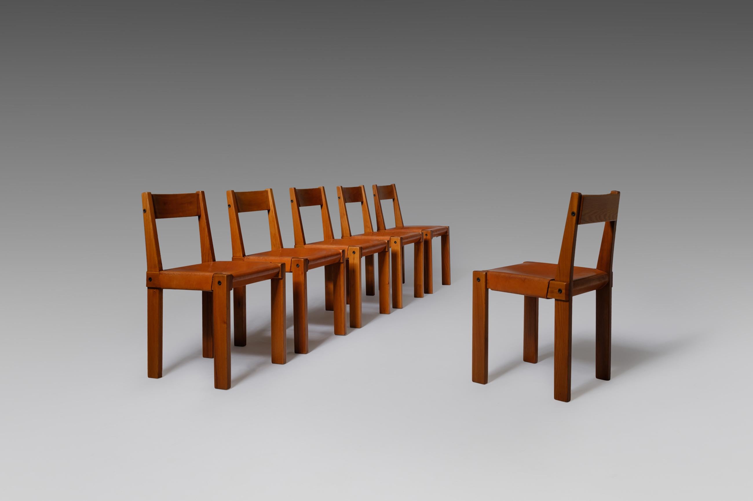 Set of six ‘S24’ dining chairs by Pierre Chapo, France, 1966. Made of solid elmwood with beautifully patinated cognac saddle leather seating. The well-crafted solid French elm wooden frame and backrest immediately catches the eye. Very interesting
