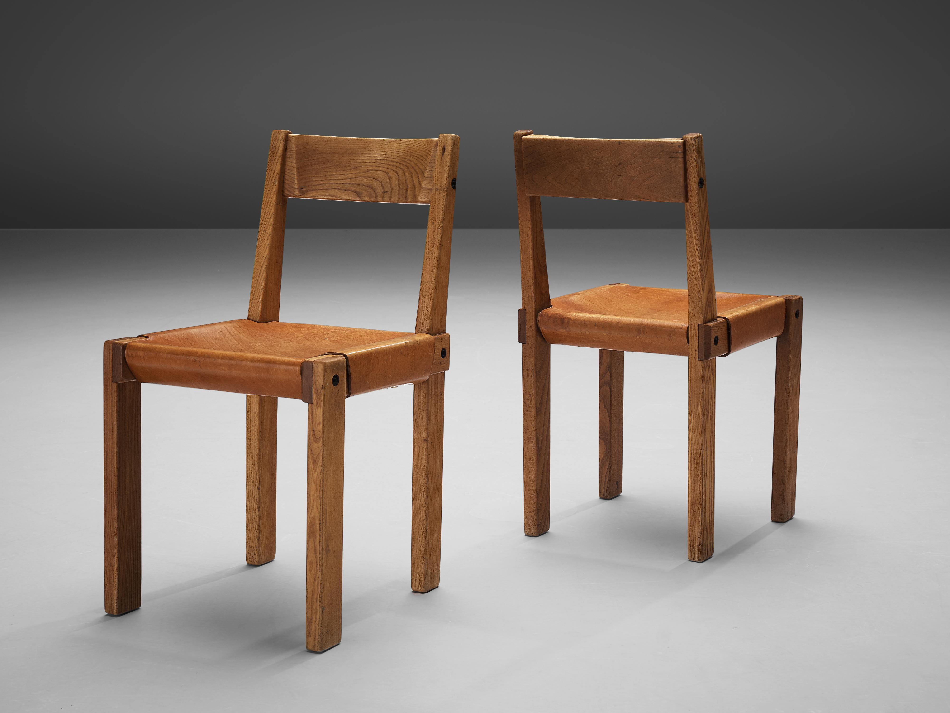 Pierre Chapo, dining chairs model S24, elm, leather, France, circa 1966

Dining chairs in solid elmwood with saddle leather seating and back designed by French designer Pierre Chapo. These chairs have a cubic design of solid elmwood with dark