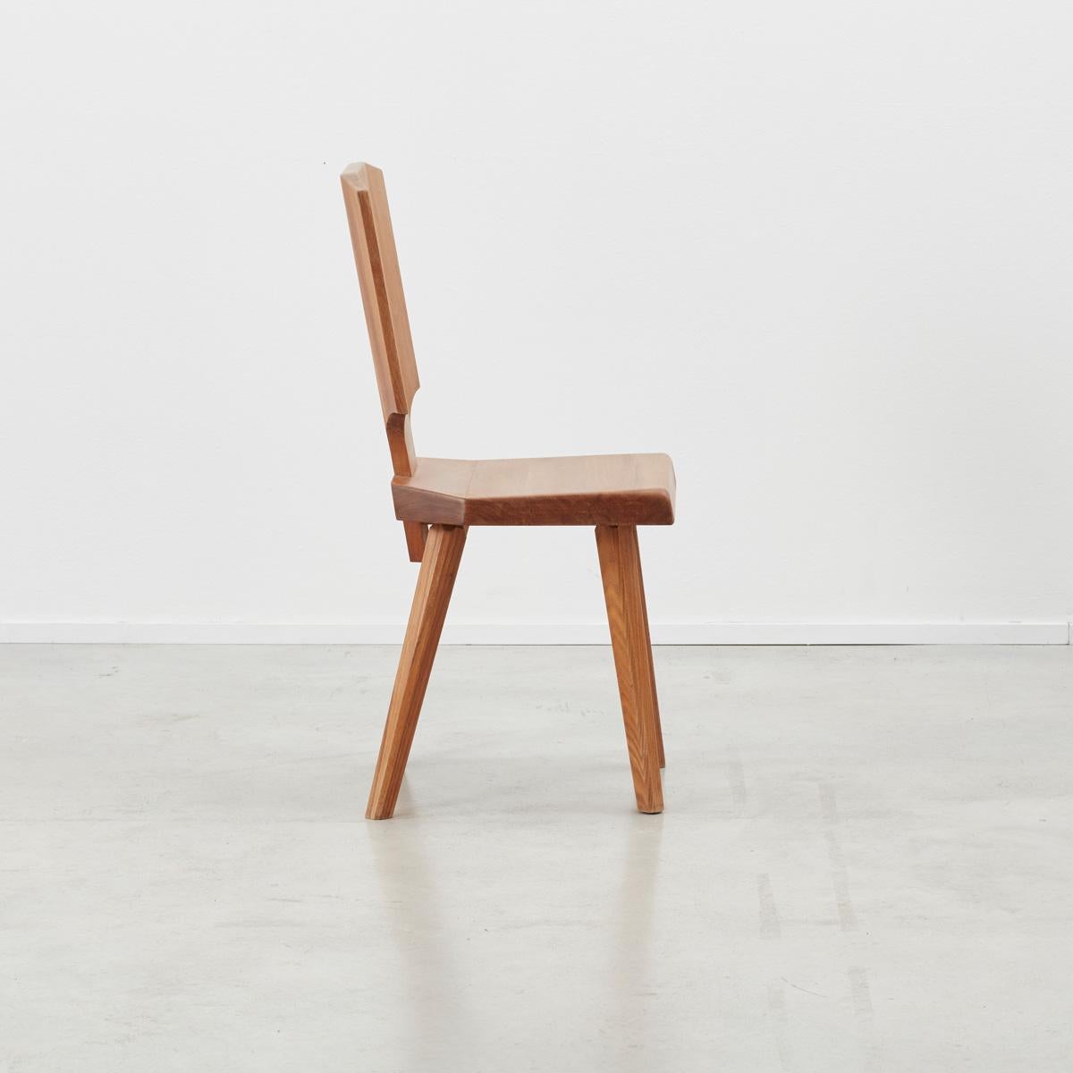 Set of four Pierre Chapo S28 dining chairs made from solid elmwood, designed in 1972, produced late 20th century. The S28 was inspired by Chapo’s travels to Alsace. He wanted to reinvent a typical Alsatian folk chair, without its decorative