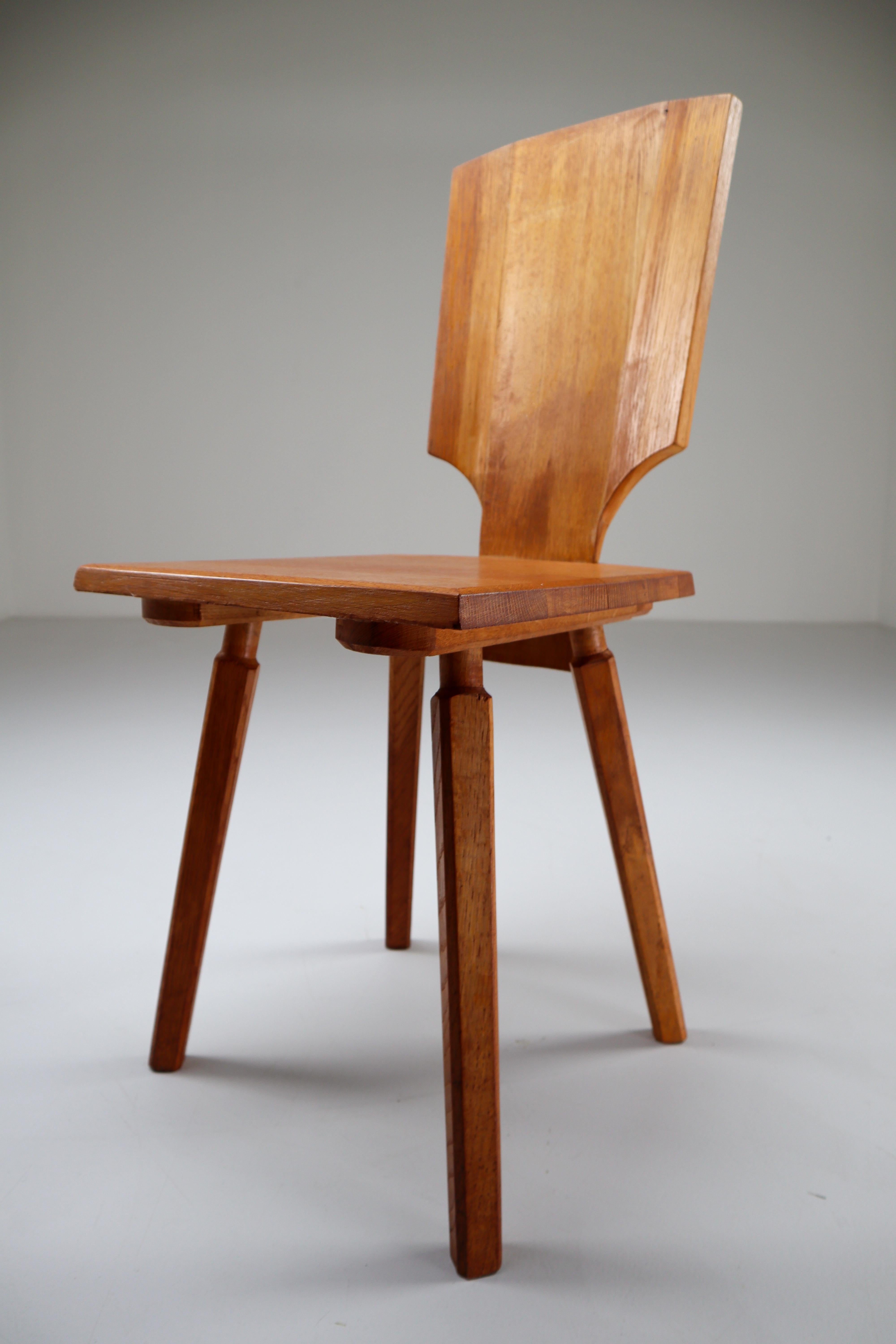 Set of four Pierre Chapo S28 dining chairs made from solid elmwood, designed in 1972. The S28 was inspired by Chapo’s travels to Alsace. He wanted to reinvent a typical Alsatian folk chair, without its decorative elements. The back is made of a