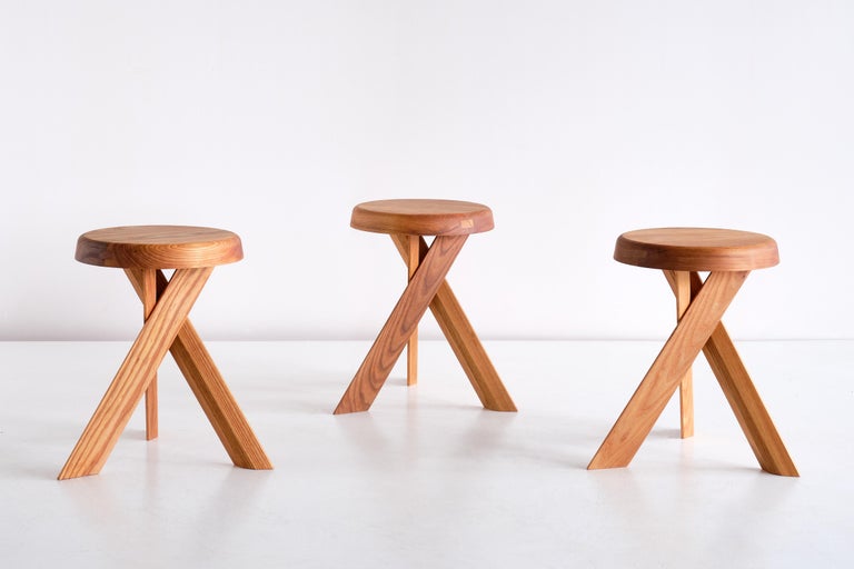 This striking three-legged stool is the model S31 designed by Pierre Chapo in 1974. The cross legged base and round seat are in solid elm wood. This stool also (could work) works well as a small side table.

This new stool was made by Chapo