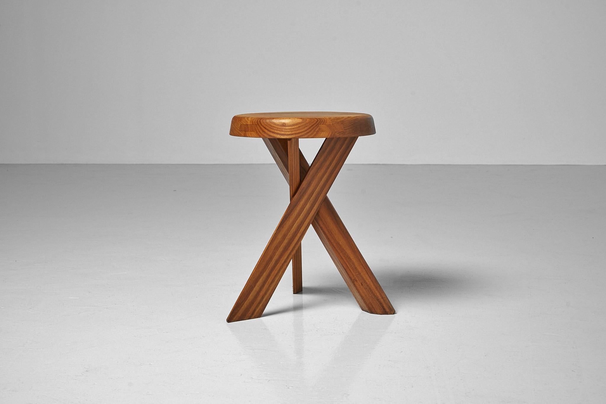 Sculptural iconic model  S31A stool designed by Pierre Chapo and manufactured in his own workshop, France 1970s. This stool is made of solid elmwood has very nice constructed seat. The wood-joint connections of the crossed table legs are a typical