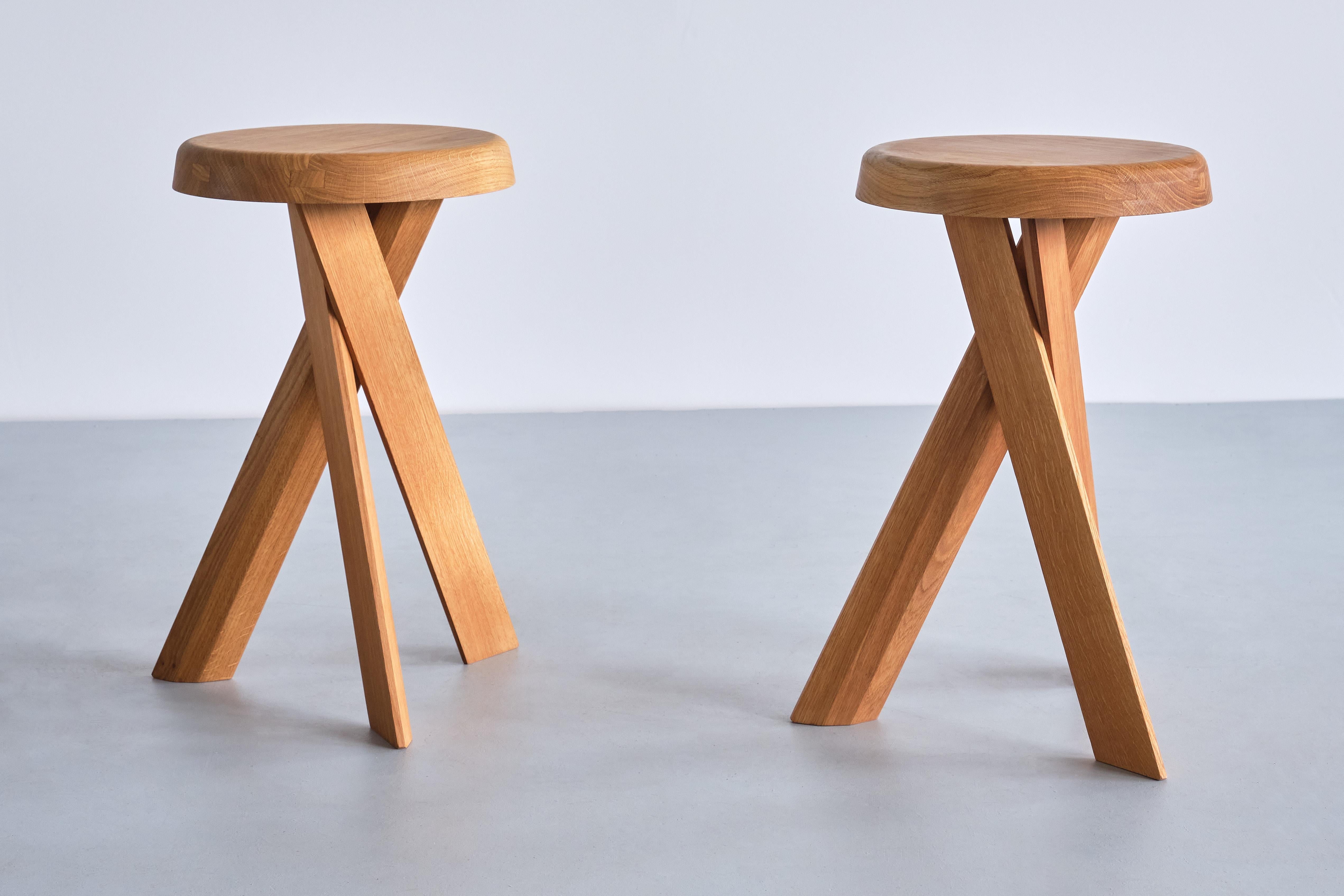 This striking three-legged stool is the model S31-B designed by Pierre Chapo in 1974. The cross legged base and round seat are in solid oak wood. This stool also (could work) works well as a small side table.
  
We have two pieces in stock available