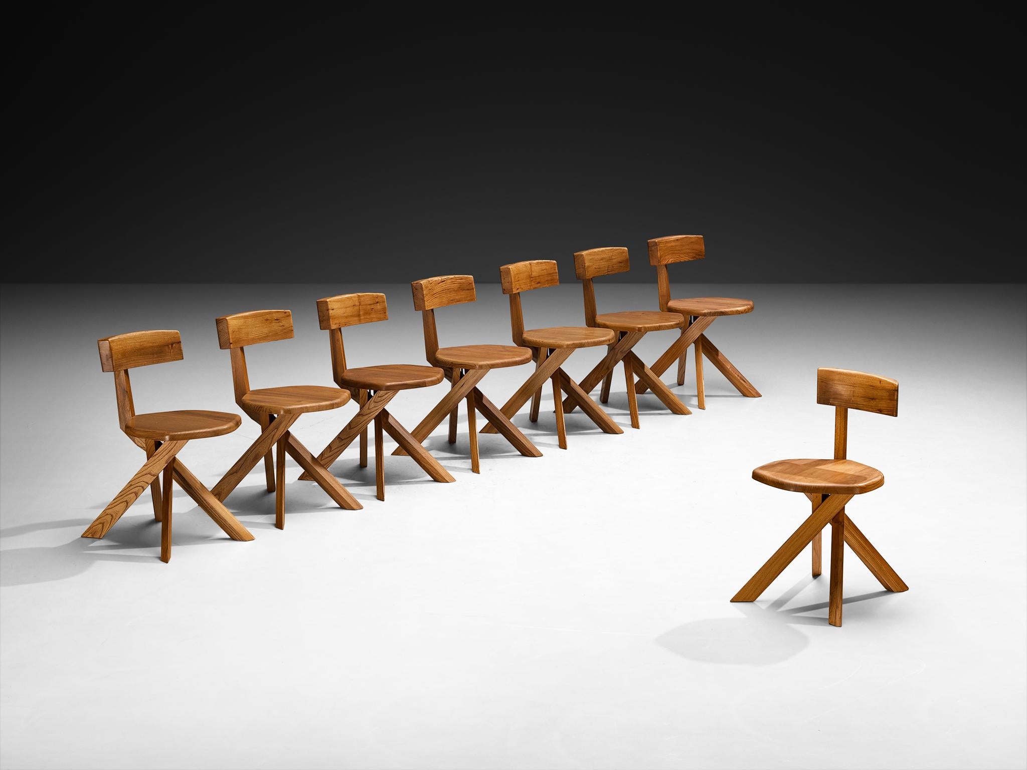 Pierre Chapo, set of eight chairs, model 'S34A', solid elm, France, circa 1973 

This chair model 'S34A' is designed by Pierre Chapo circa 1973. This asymmetrical chair executed in elm with seven-shaped back and twisted base is a true icon of