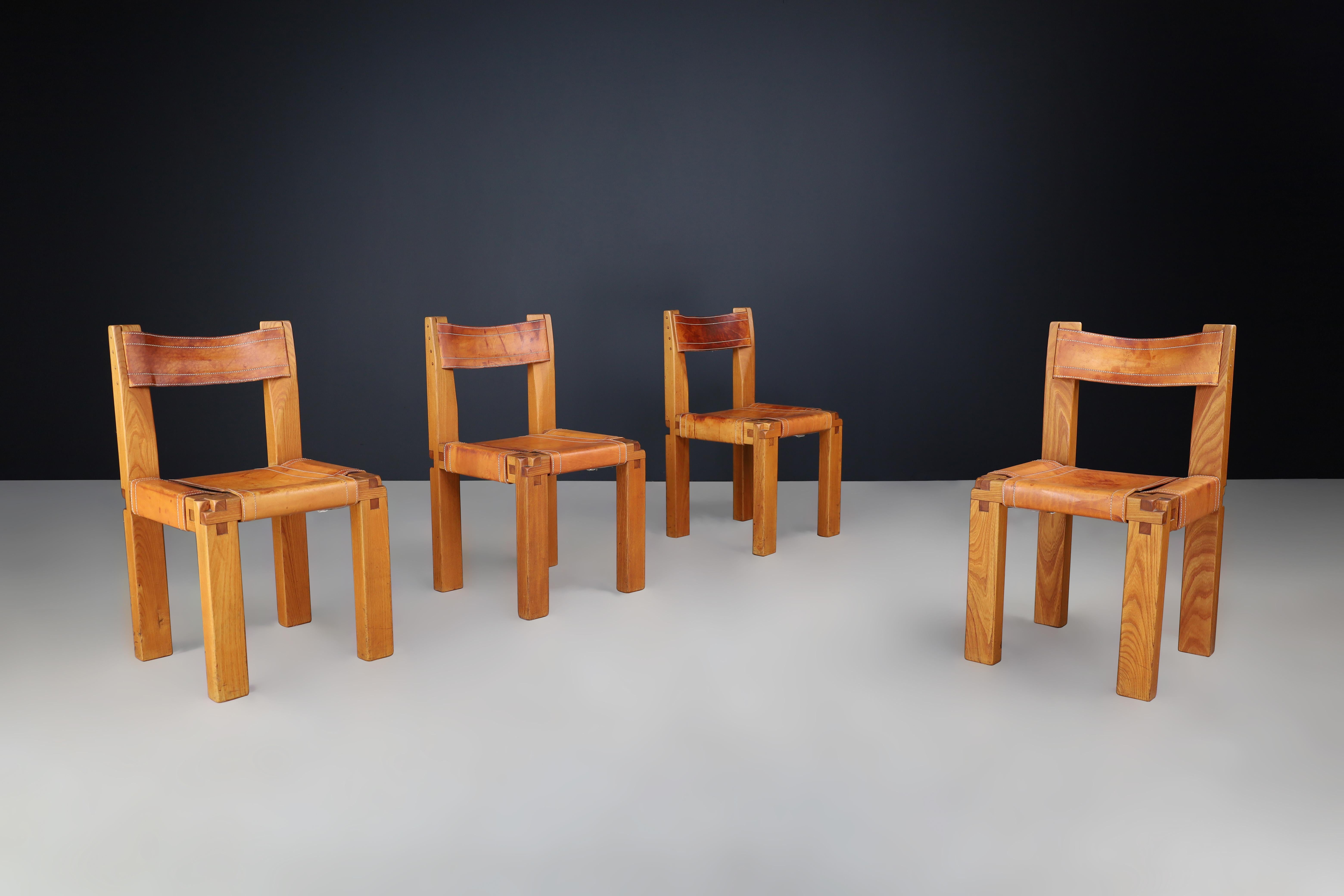 Pierre Chapo Set of Four 'S11' Chairs in Cognac Leather and Elm, France 1960s

These are a set of four dining chairs designed by Pierre Chapo, model 'S11', crafted in France in the 1960s. These chairs are an early edition and are made of solid