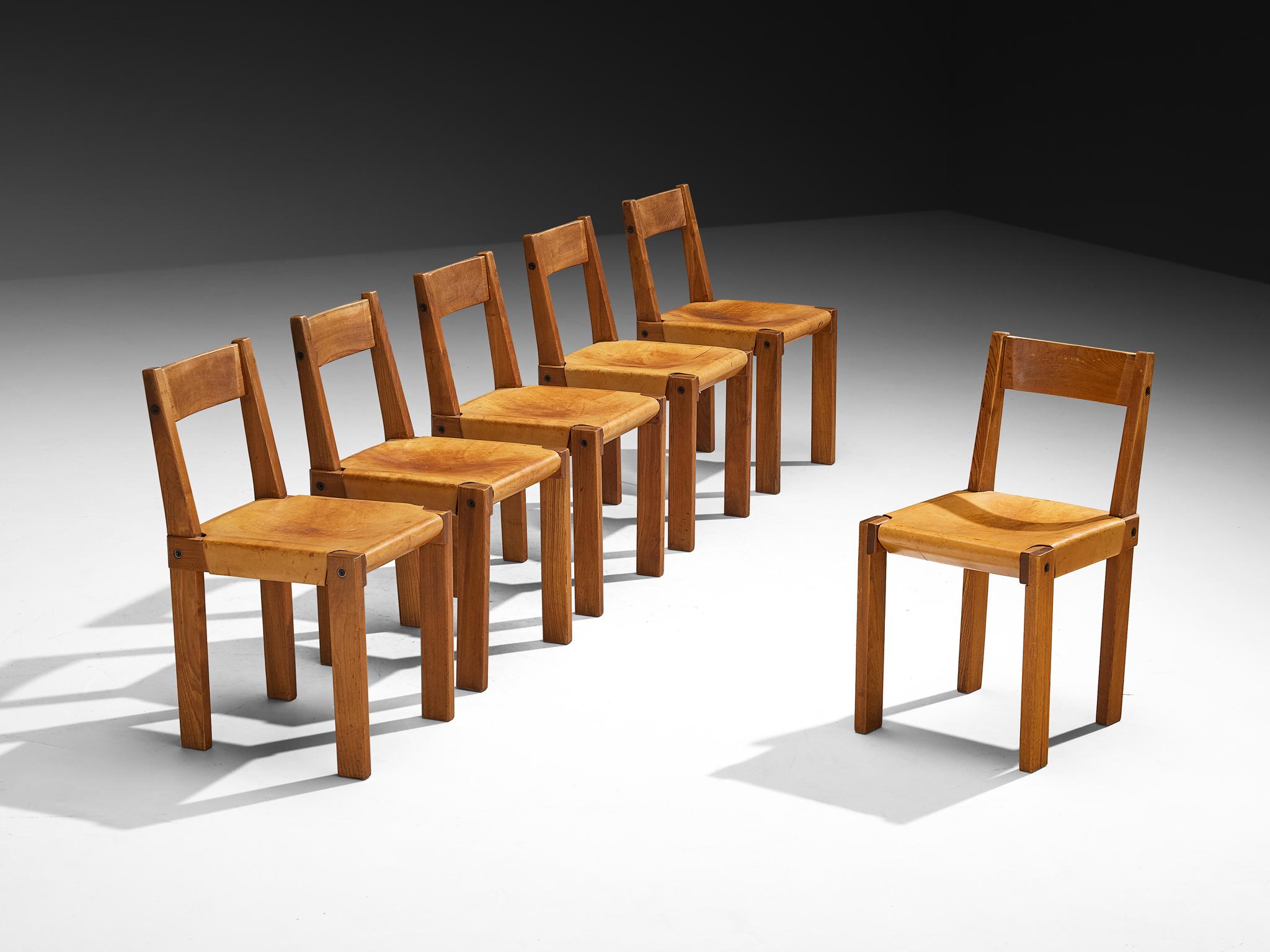 Pierre Chapo, set of six dining chairs, model 'S24', solid elm, cognac leather, rope, brass, France, 1960s

A set of six 'S24' chairs in solid elmwood with saddle leather seating. Designed by French designer Pierre Chapo, these chairs show a cubic