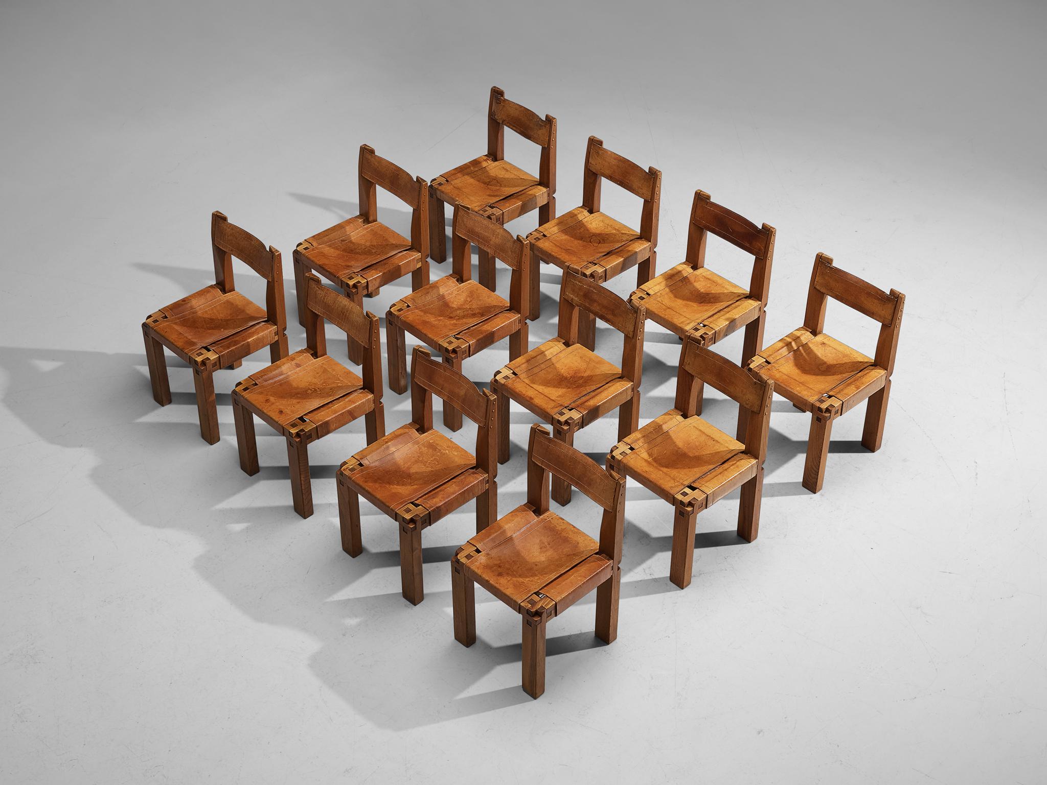 Pierre Chapo, set of twelve dining chairs model 'S11', elm, leather, France, circa 1966.

A set of twelve chairs in solid elmwood with cognac leather seating and back, designed by French designer Pierre Chapo. The chairs show absolutely stunning