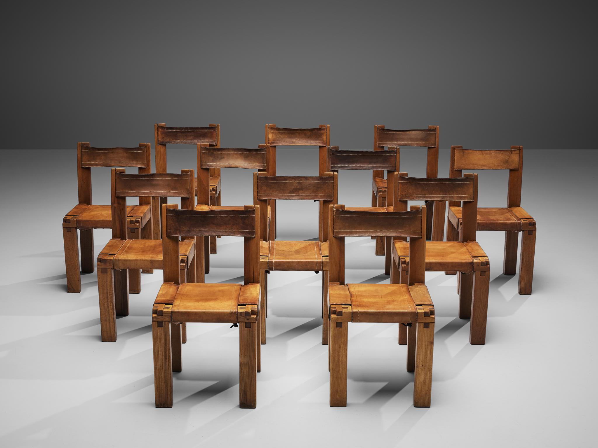 Pierre Chapo, set of twelve dining chairs, model S11, elm and leather, France, circa 1966

A set of twelve chairs in solid elmwood with cognac leather seating and back, designed by French designer Pierre Chapo. These chairs have a cubic design of