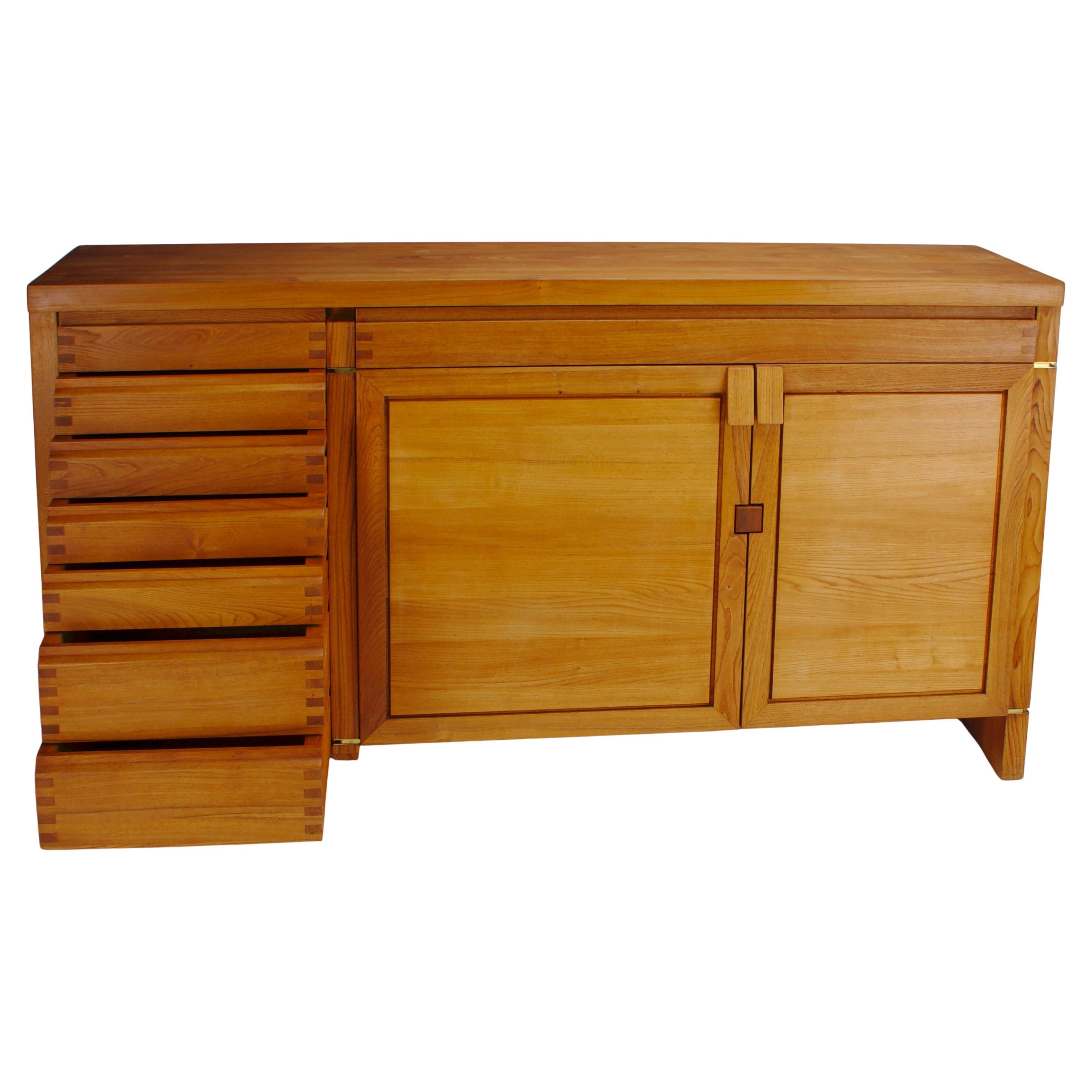 This R13 sideboard by Pierre Chapo is a remarkable example of mid-century French craftsmanship, designed in the 1960s and constructed entirely from solid elmwood. Chapo’s signature approach to functionality and aesthetics is evident in the precise