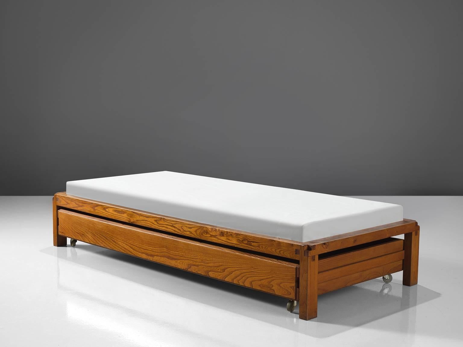 Pierre Chapo, bed with drawer, model L03, France, ca. 1965. 

This bed is designed by Pierre Chapo in 1965. The bed has storage underneath in the shape of a large drawers with wheels. The bed features the hand-crafted joints that the woodworker