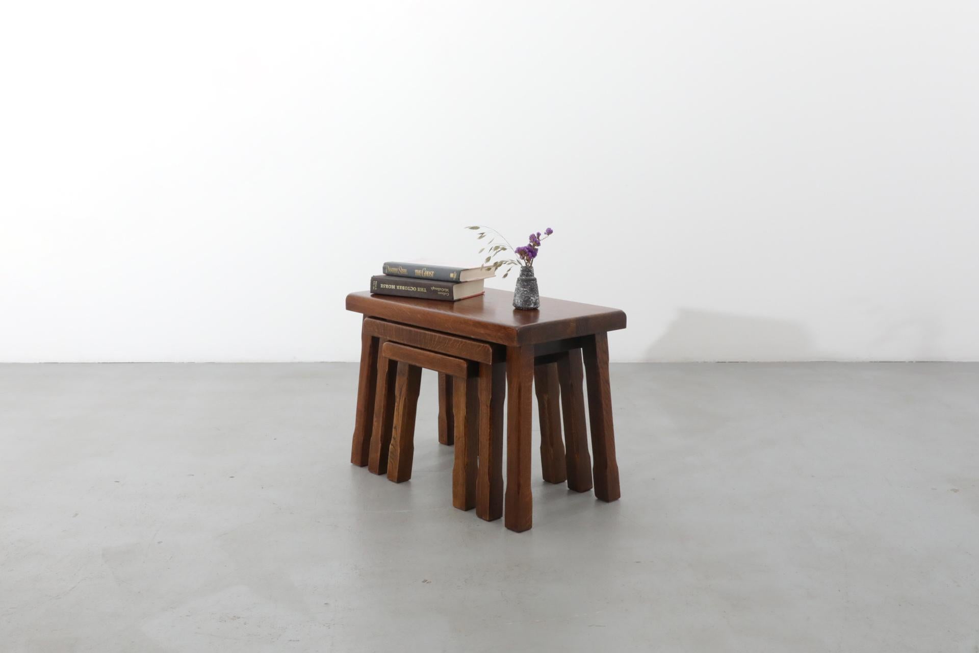 Set of beautiful Pierre Chapo inspired oak nesting tables. Solid oak with decoratively carved legs and solid tops. Large table is 24.75 x 13.75 x 17.75