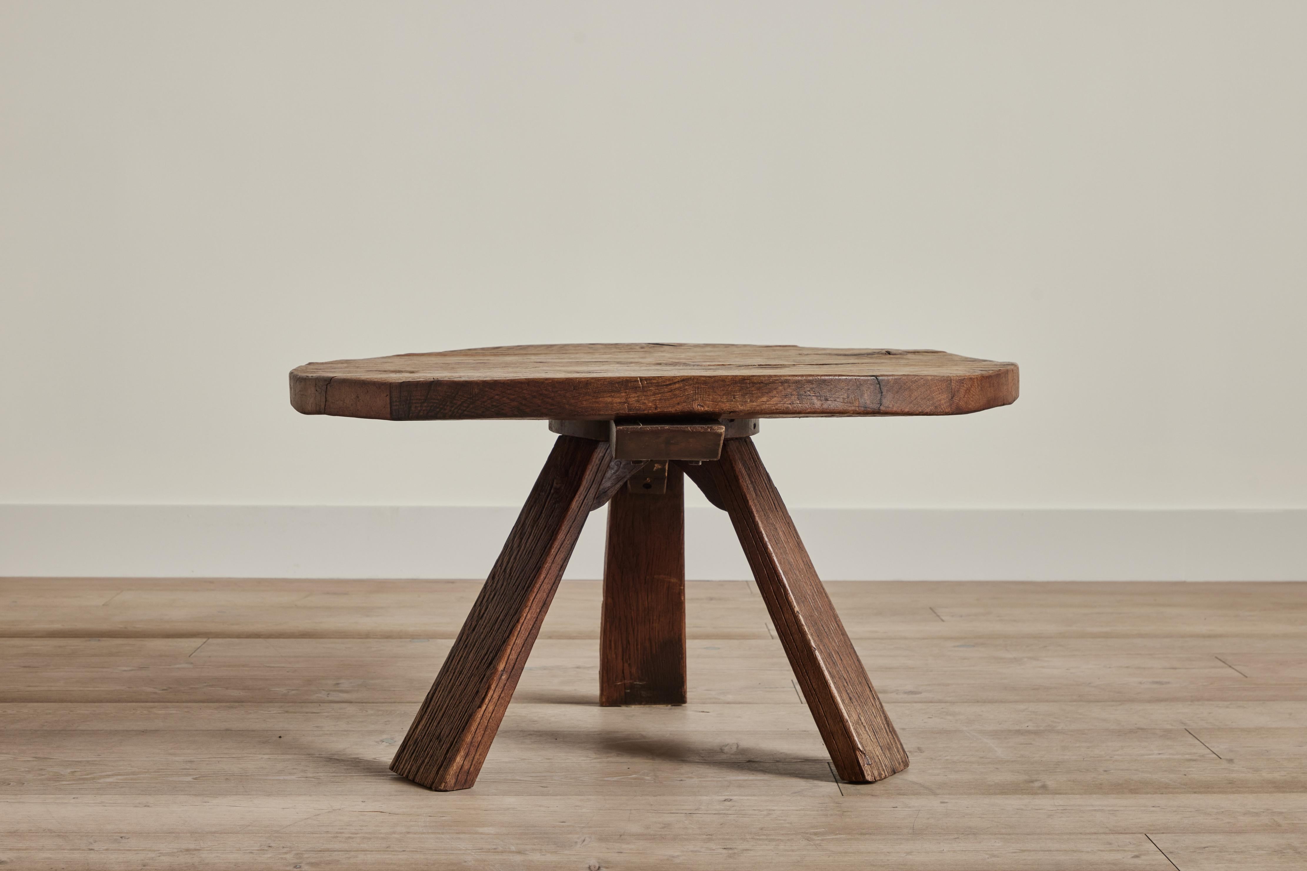 Round wood coffee table from France circa 1960 in the style of Pierre Chapo. Wear throughout on wood is consistent with age and use.