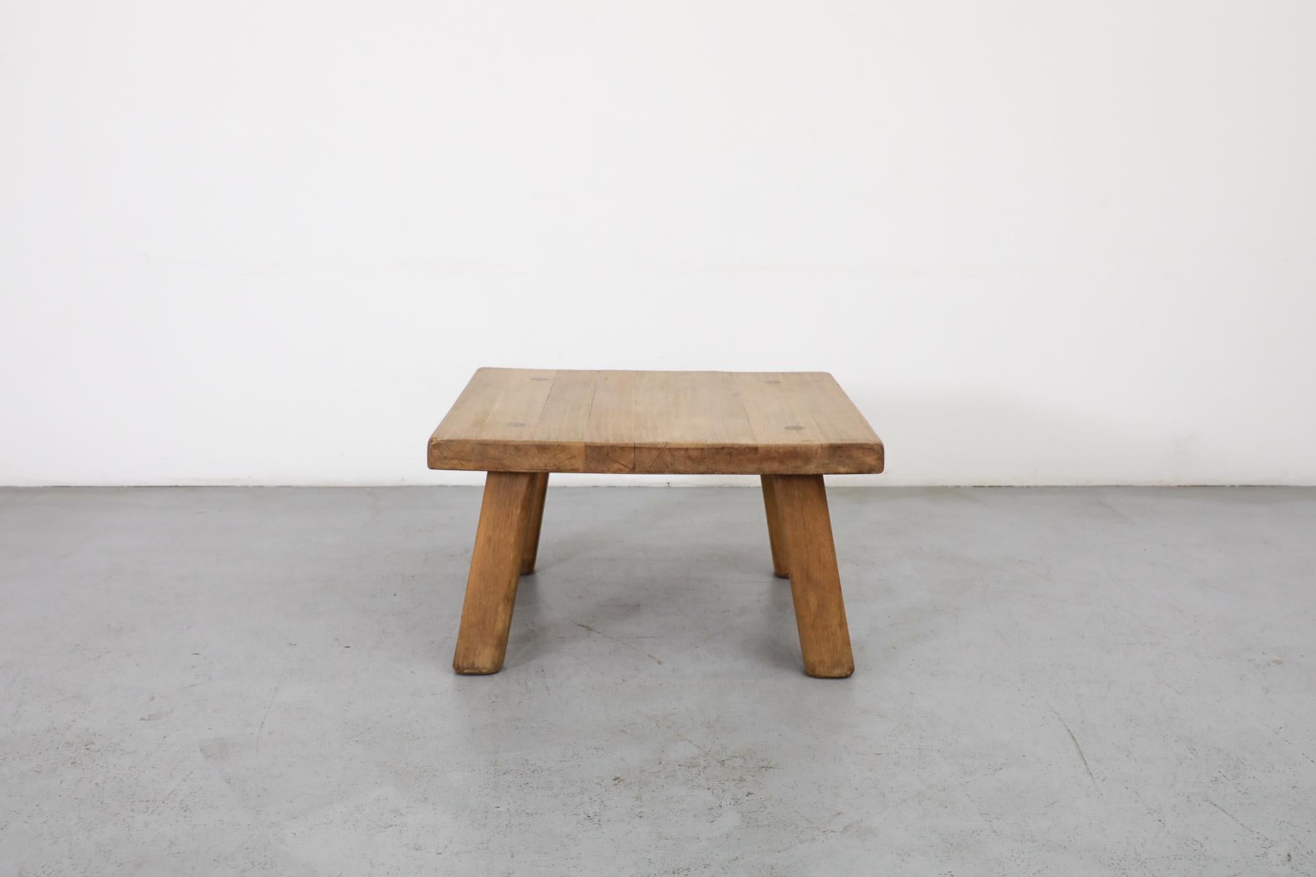 Pierre Chapo style Brutalist square oak coffee table with thick top and squared legs. Leg joinery detail visible on top. In lightly refinished condition with some wear consistent with age and use. Other similar tables available and listed separately.