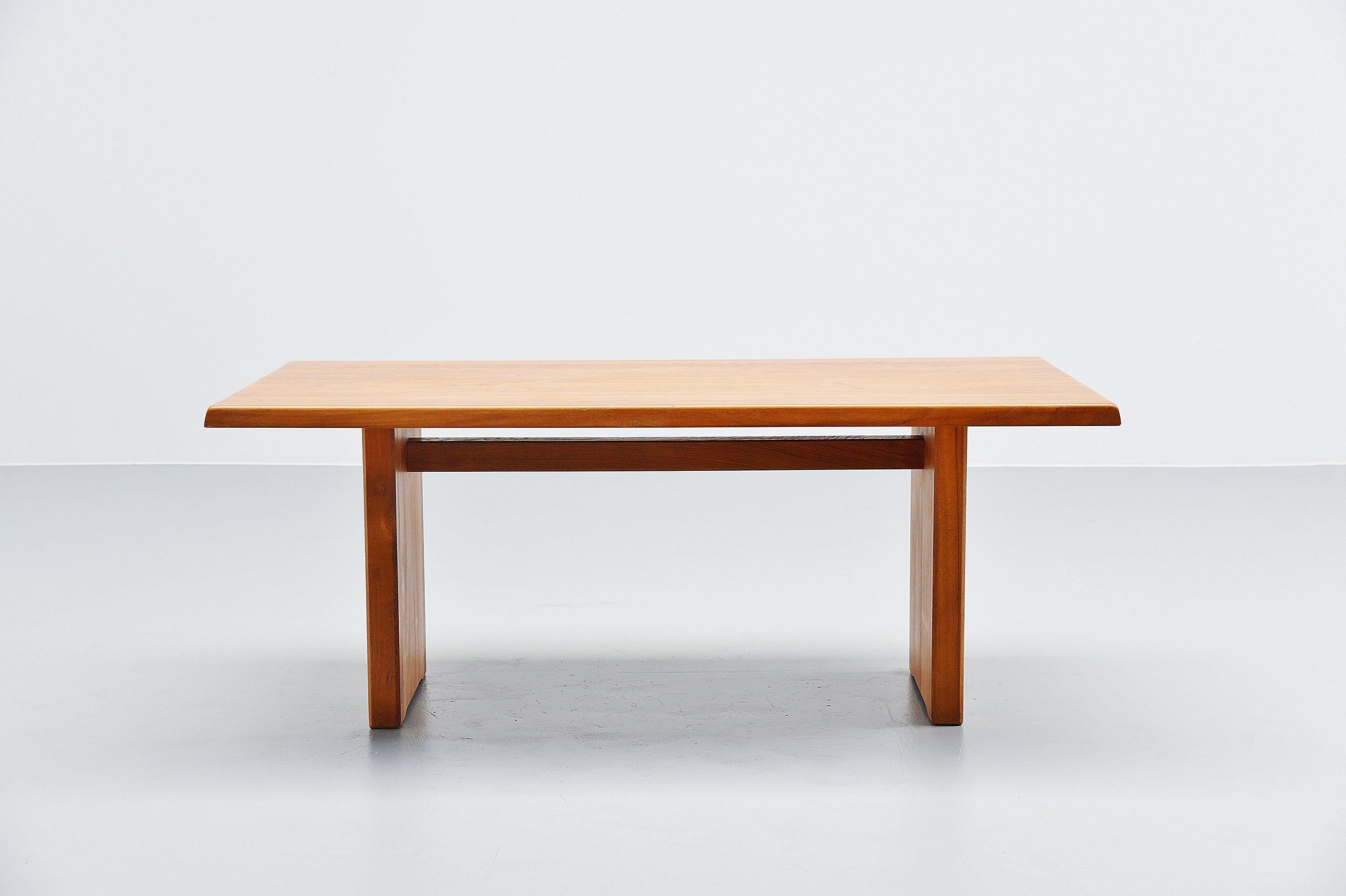 Beautiful early, super conditioned T14C dining table designed by Pierre Chapo and manufactured in his own workshop, France 1963. This dining table is made of solid elmwood has very nice constructed tabletop. The wood-joint connections in the table