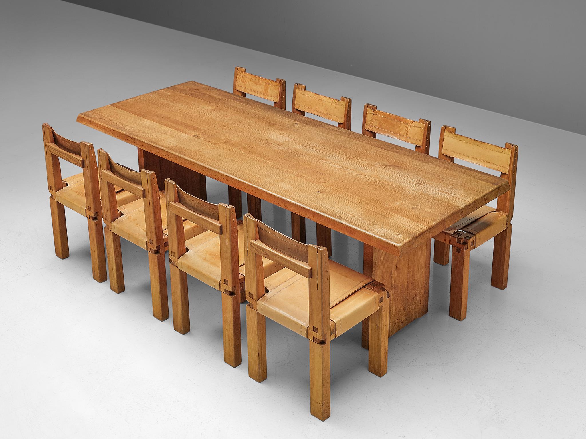 Pierre Chapo, dining table model T14C in elm, set of eight dining chairs model S11 in elm and leather, France, 1960s.

A beautiful dining room set by the French designer Pierre Chapo. 
 The dining table has a strong and simplified design which