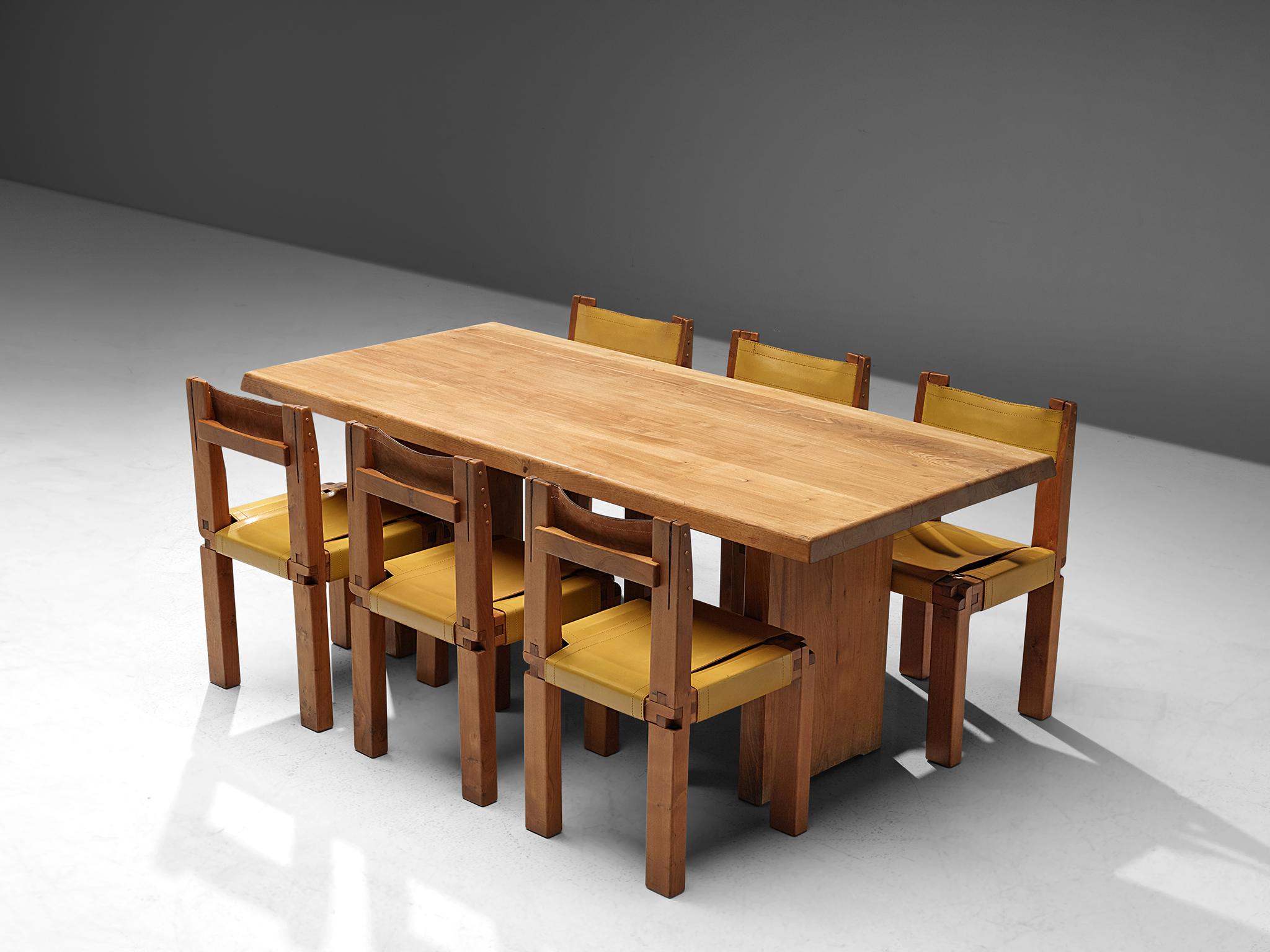 Pierre Chapo, dining table model T14C in elm, and set of six dining chairs model S11 in elm and yellow leather, France, 1960s.

A beautiful dining room set by the French designer Pierre Chapo. 
The dining table has a strong and simplified design