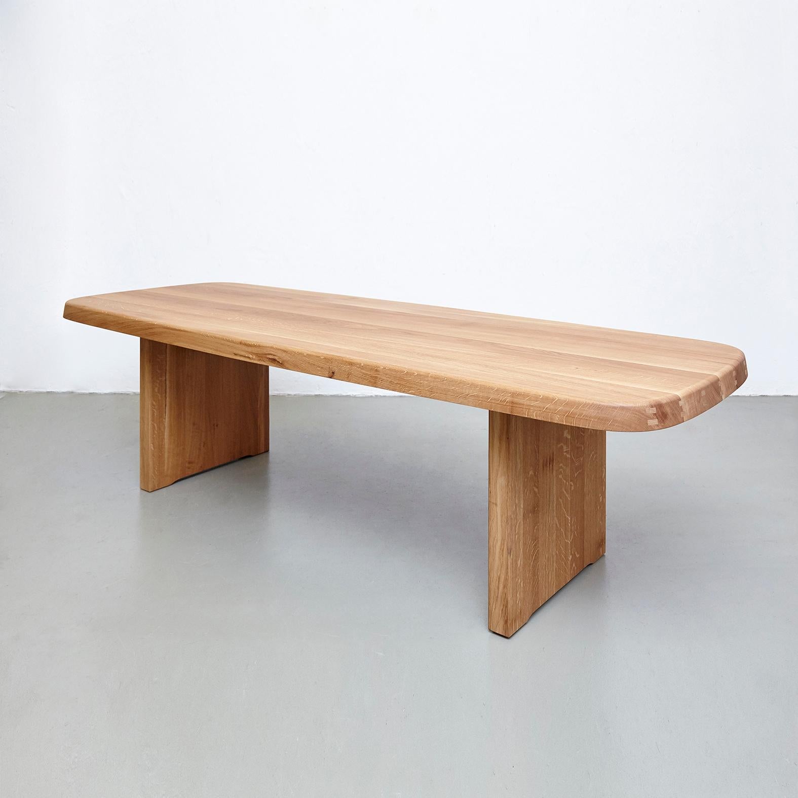 T20A dining table designed by Pierre Chapo.
Manufactured by Chapo Creation (France), 2019.
Solid oakwood.

Dimensions dining table: 74 cm H x 260 cm W x 96 cm D.

In original condition, with minor wear consistent with age and use, preserving a