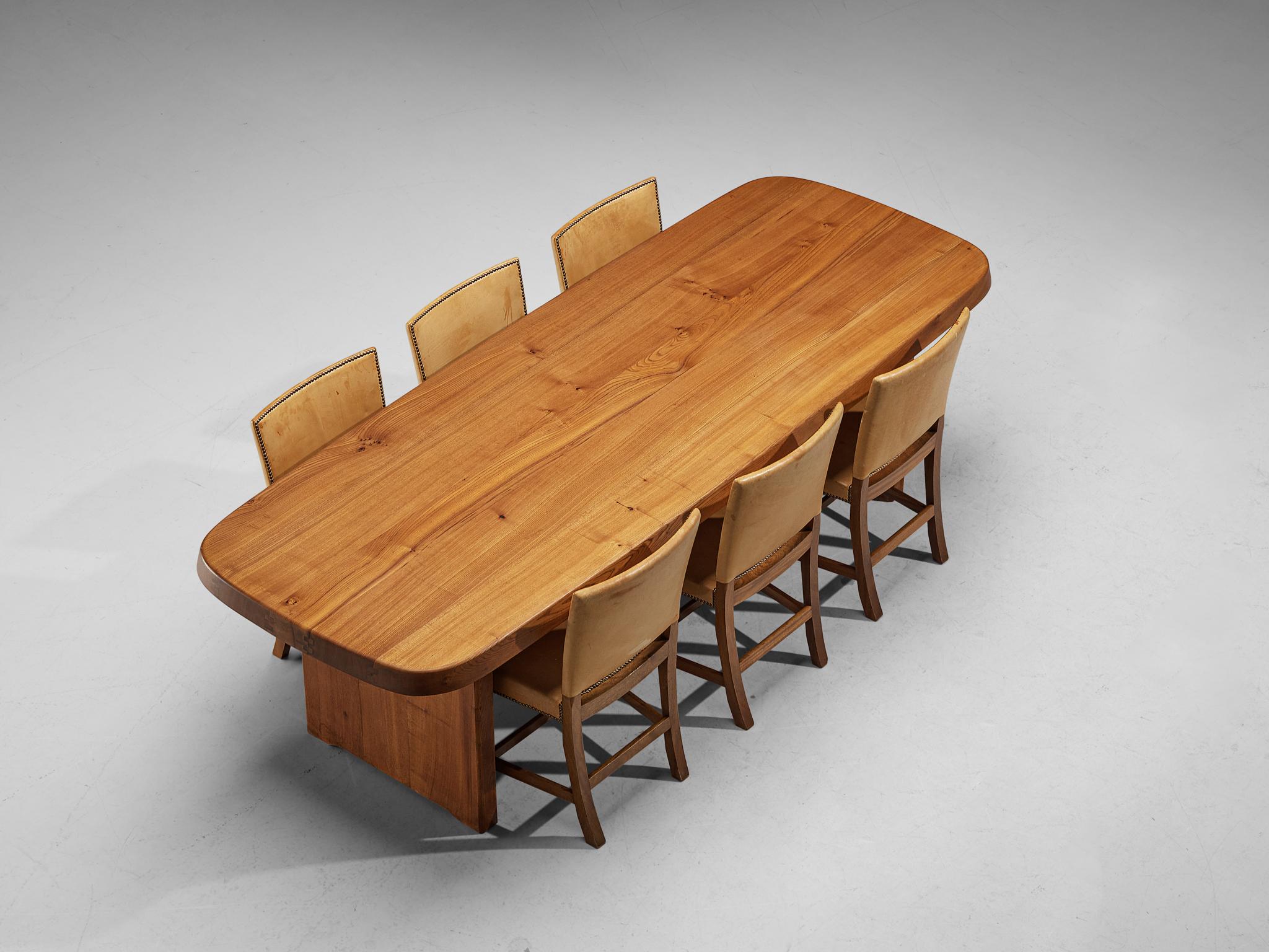 Pierre Chapo, dining table, model T20A, elmwood, France, 1970s.

This design is an early edition, created according to the original craft methodology of Pierre Chapo. The table is designed in 1972 when Pierre Chapo revisited the idea of the T14