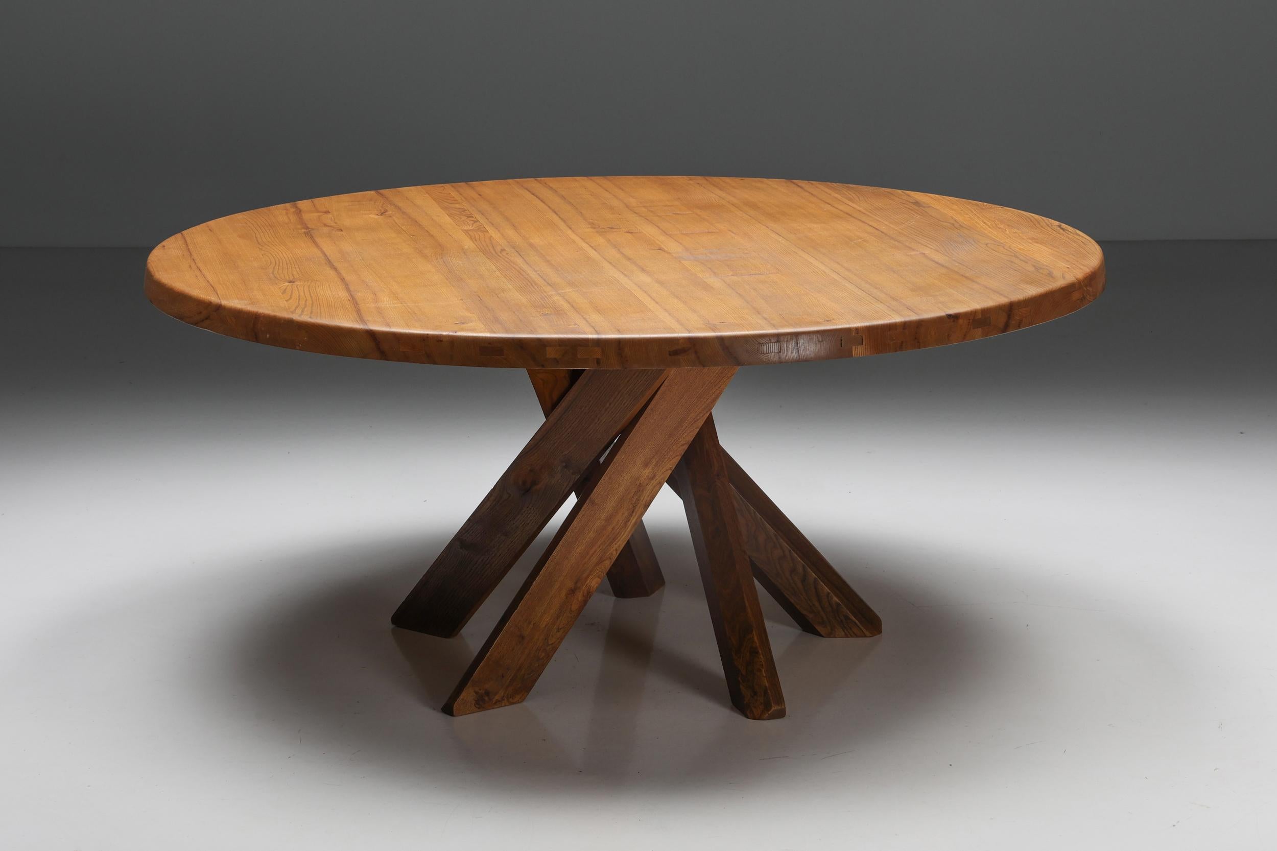 Pierre Chapo; Model T21; Round Dining Table; Solid Elm; Wood; Crossed Feet; France; 1973; Woodworking; Mid-Century Modern; French Craftsmanship;

A Pierre Chapo 'T21' round dining table in solid elm, composed of a thick top with a natural veining