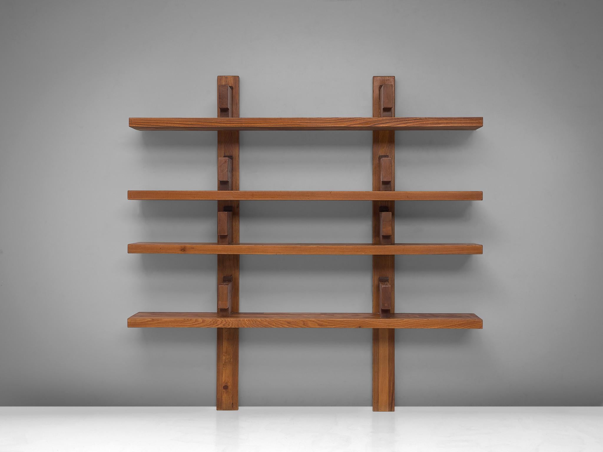Pierre Chapo, wall unit 'bibliothèque' model B17, elm, France, 1960s

This is a wall-mounted book shelf model 'B17' designed by Pierre Chapo. The shelving system was created in 1967 where it was presented at the Salon des Arts Ménagers. This
