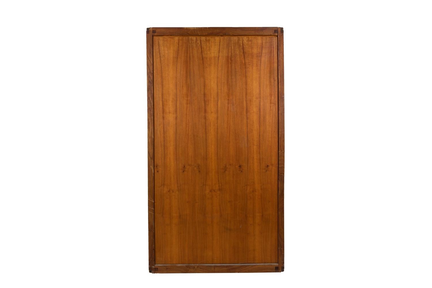 Pierre Chapo, signed.

Rectangular wardrobe in natural elm. It opens by two door and lets appear a metal bar and a board lifting thanks to a cremona and tassel system.

French work realized in 1979.

Model B10.

Source: Hugues Magen (dir.),