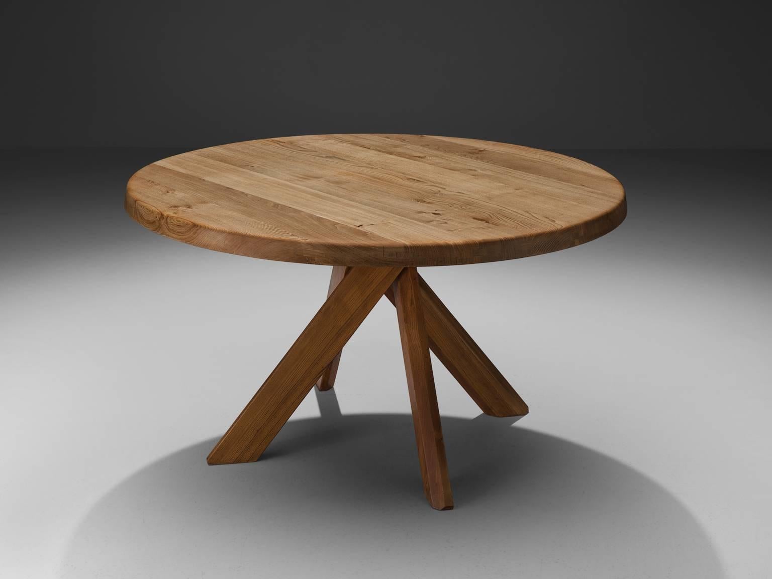 Pierre Chapo, round T21C dining table, elm, France, ca. 1973.

The basic design and constructions, as well as the use of solid Elmwood characterizes the work of Chapo. The interesting base of the table is build with 5 stems, with angled edges to
