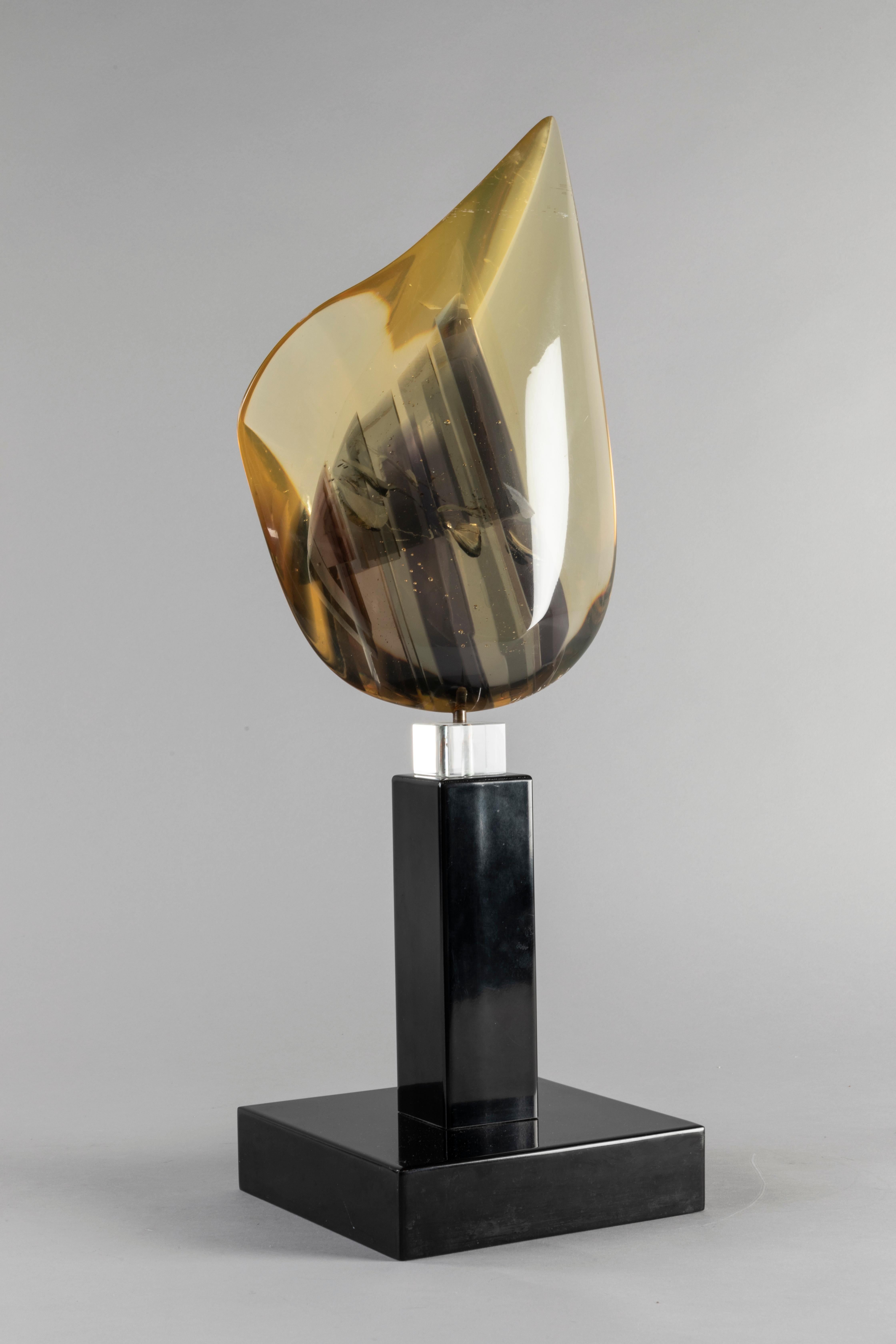 In 1970s Pierre Charbin (Gilles his real name) created most of his pieces in resin. This amber sculpture color is unique with inclusions inside, it comes from a private collection. (Signed and dated). Gilles Charbin collaborated with famous interior