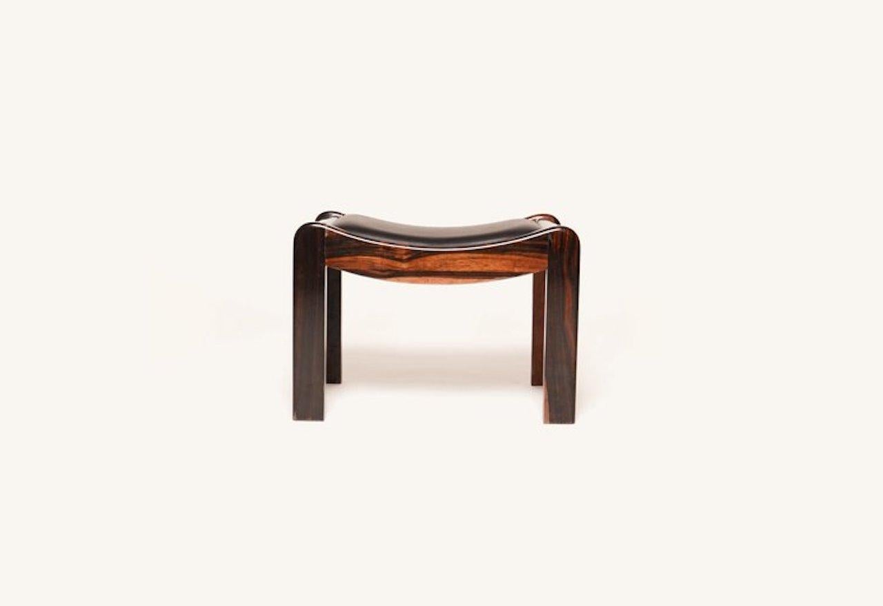 This Pierre Chareau “SN1” mahogany stool is of exceptional design created during the Art Deco period. Known famously for designing the Maison de Verre which was also referred to as the glass house in France, Chareau’s aesthetic bridged the gap