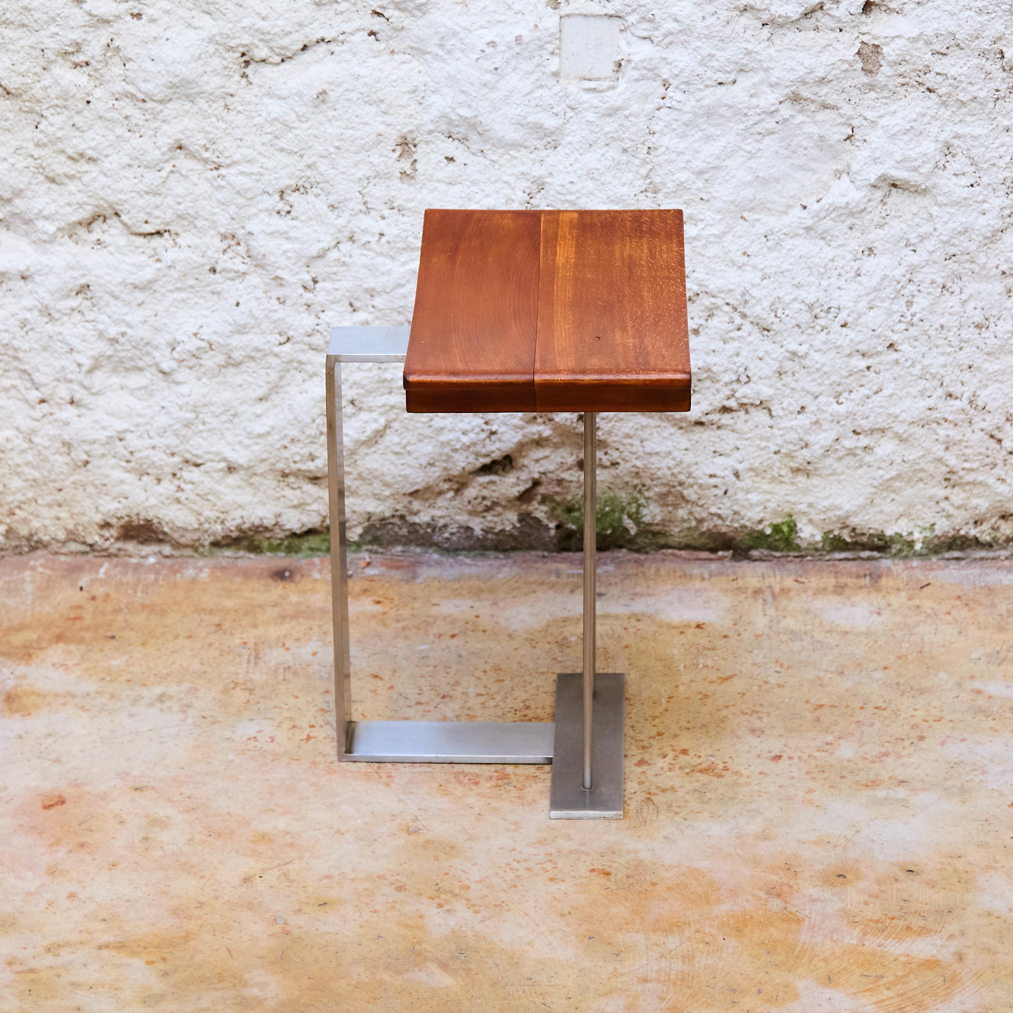 'SN3' wood and metal stool in the manner of Pierre Chareau. Reedition 'T 1927'.

Manufactured in France, circa 2000.

In good original condition, with consistent with age and use, preserving a beautiful patina with some scratches.

Dimensions: