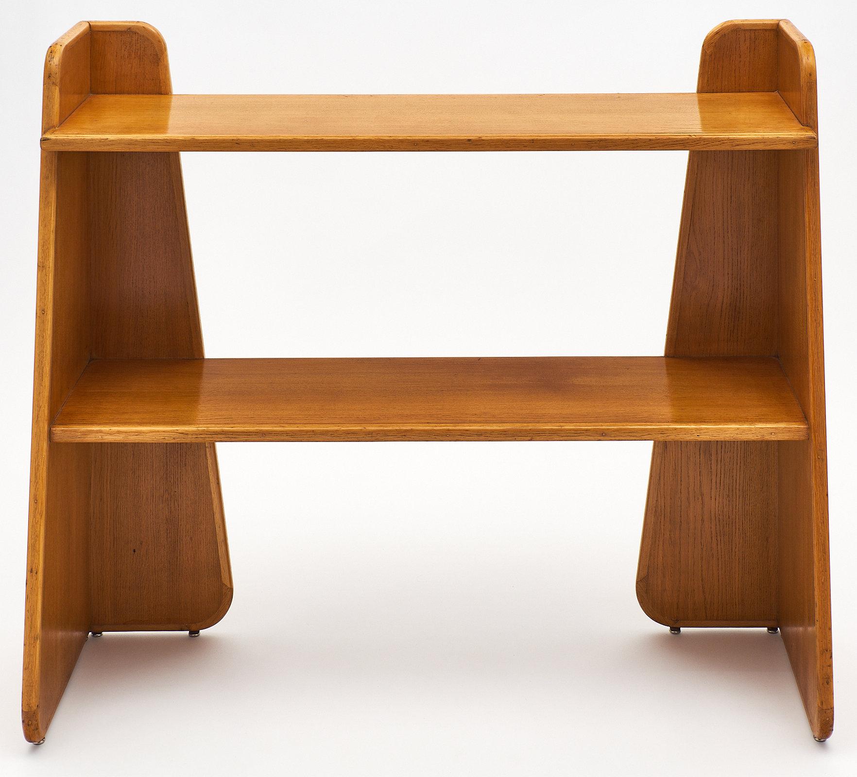 French modernist console in the manner of Pierre Chareau with side skirts and two solid oak shelves.