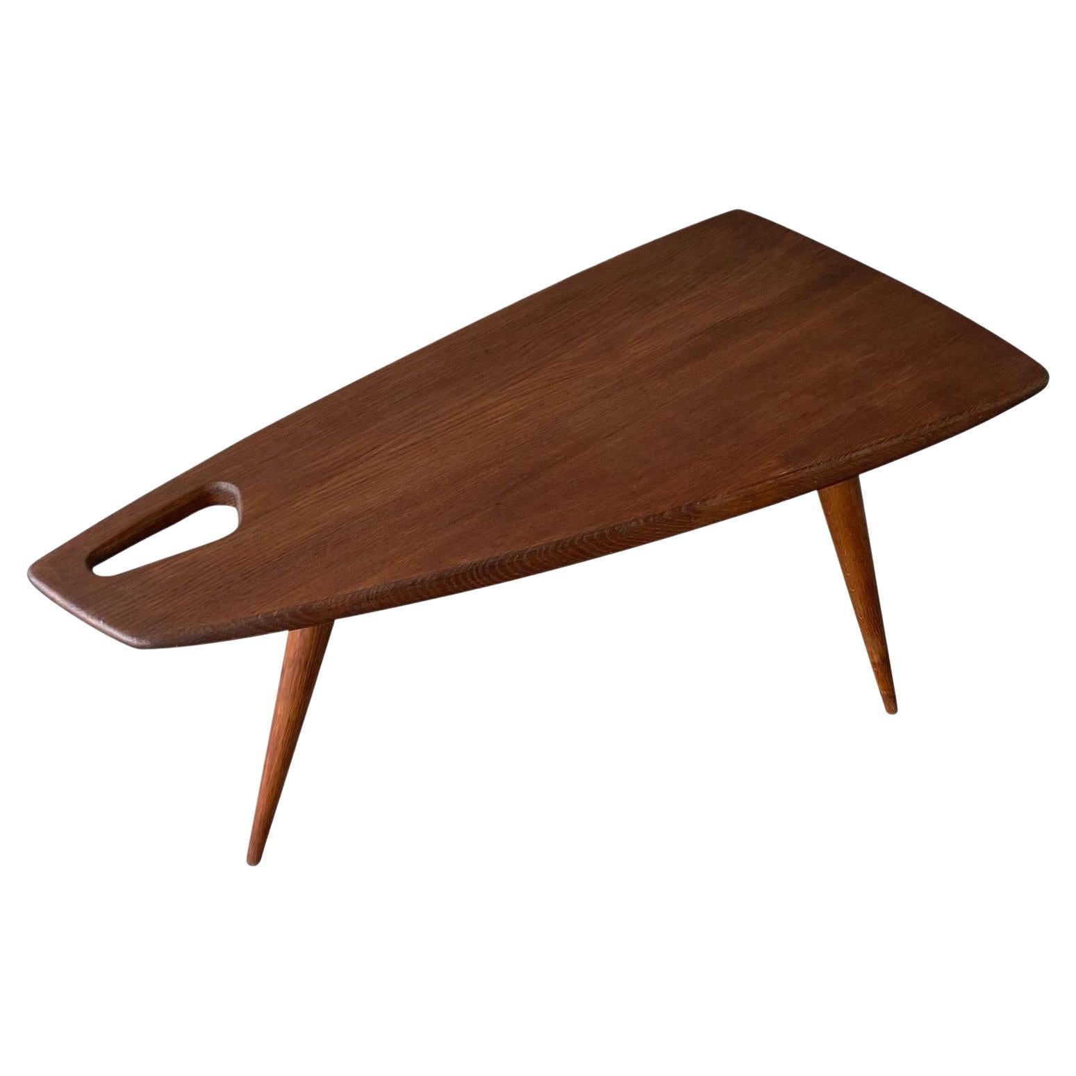 Beautiful organic shape, deep patina and lovely colour. oak coffee table by French designer Pierre Cruege, circa 1950's
