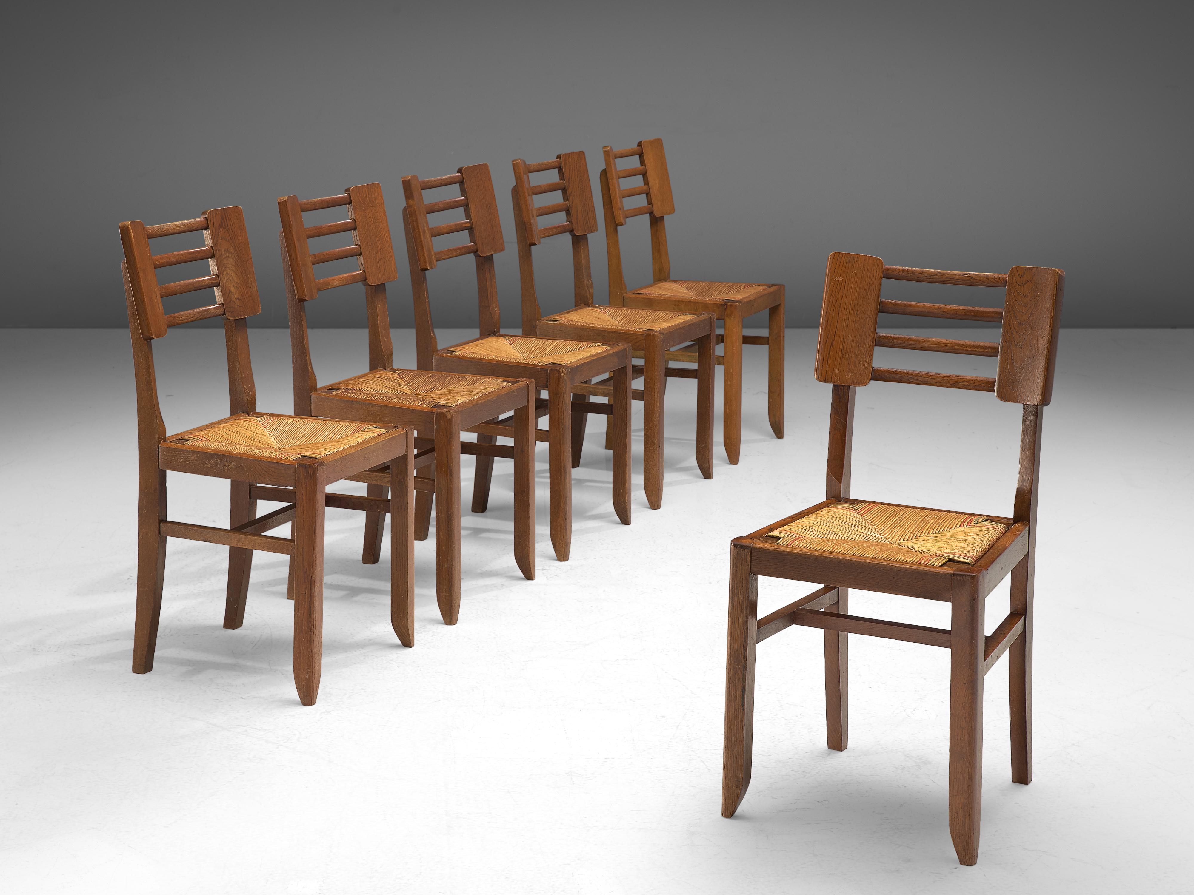 Pierre Cruège, set of six dining chairs, oak, straw, France, 1950s

Sculptural set of dining chairs by French designer and architect Pierre Cruège (1913-2003) that combines a modernist approach with Art Deco inspired forms. For instance, the model