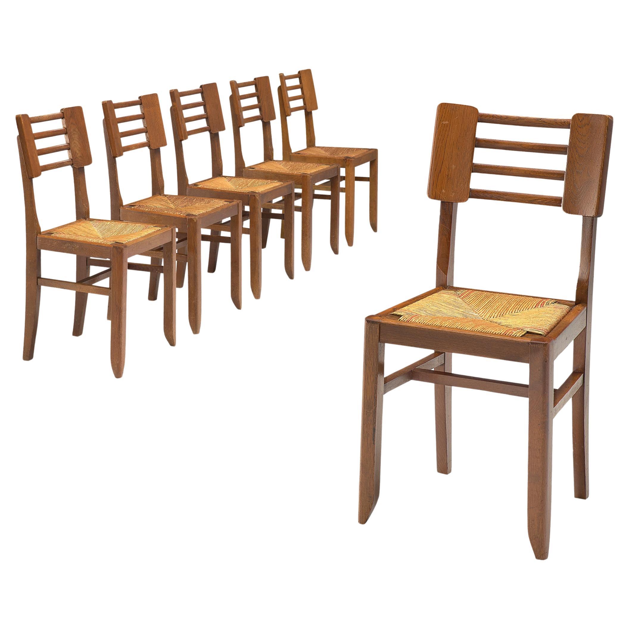 Pierre Cruège Set of Six Dining Chairs in Oak and Straw 
