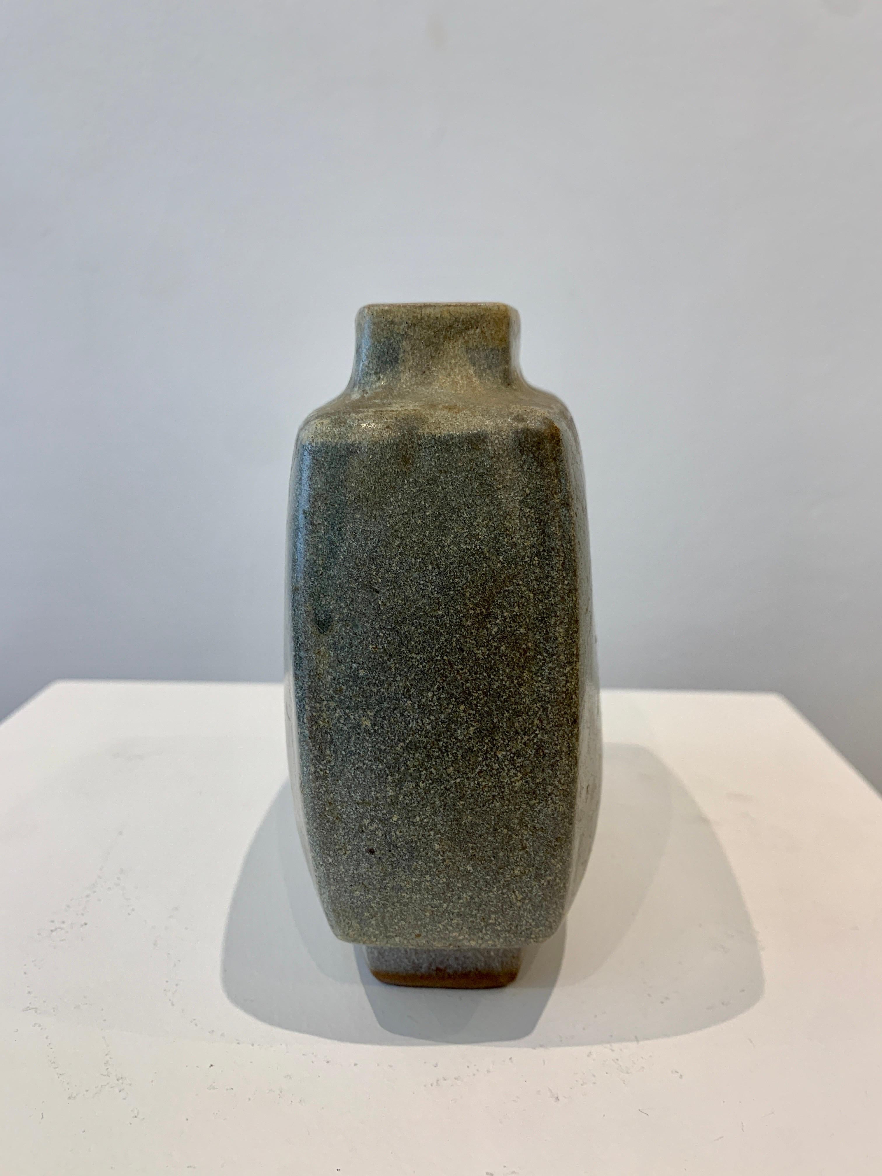 Pierre Culot is a Belgian Ceramist. The present ceramic is known as the Citroen Vase, referring to the shape of the vase. It is made of enamelled earthenware. The vase is stamped.