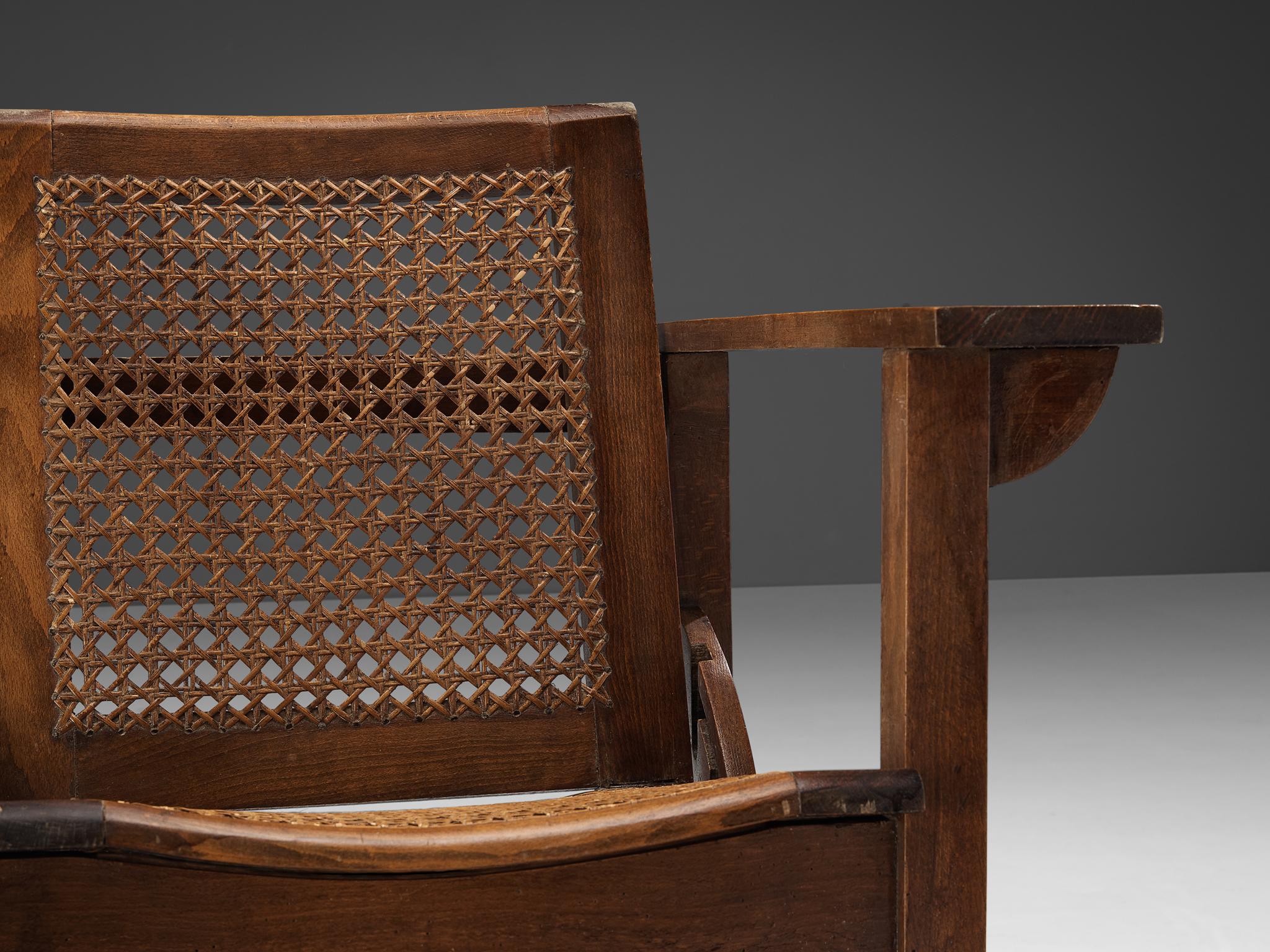 Mid-20th Century Pierre Dariel 'Hendaye' Armchair in Dark Stained Wood and Cane