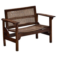 Used Pierre Dariel "Hendaye" Settee in Dark Stained Wood and Cane
