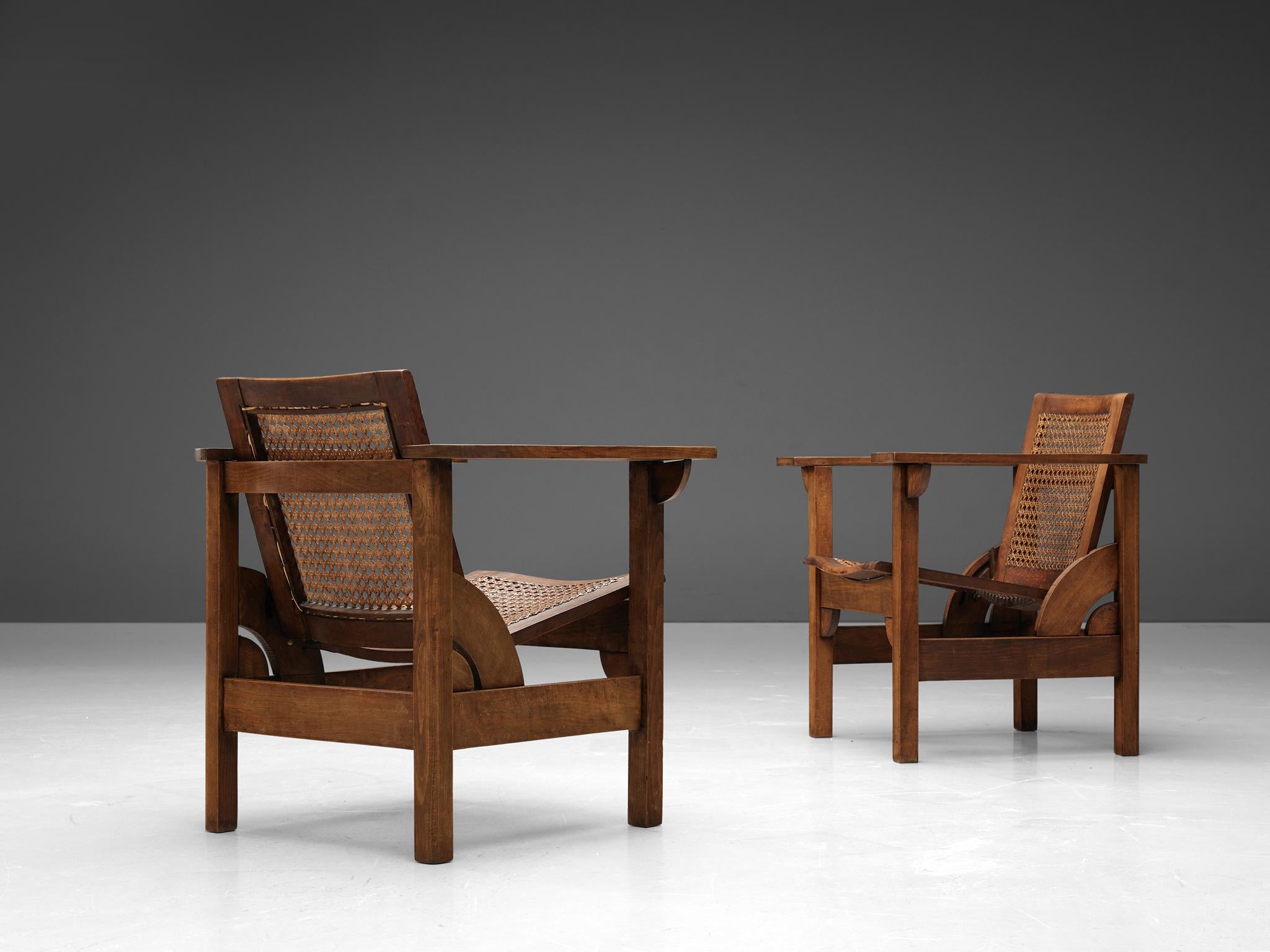 Pierre Dariel, 'Hendaye' armchairs, beech, cane, France, 1930s. 

Sturdy Hendaye model lounge chair designed by Pierre Dariel in the 1930s. The wooden framework is executed in beech, whereas the seat and backrest are made of cane. Unique to this
