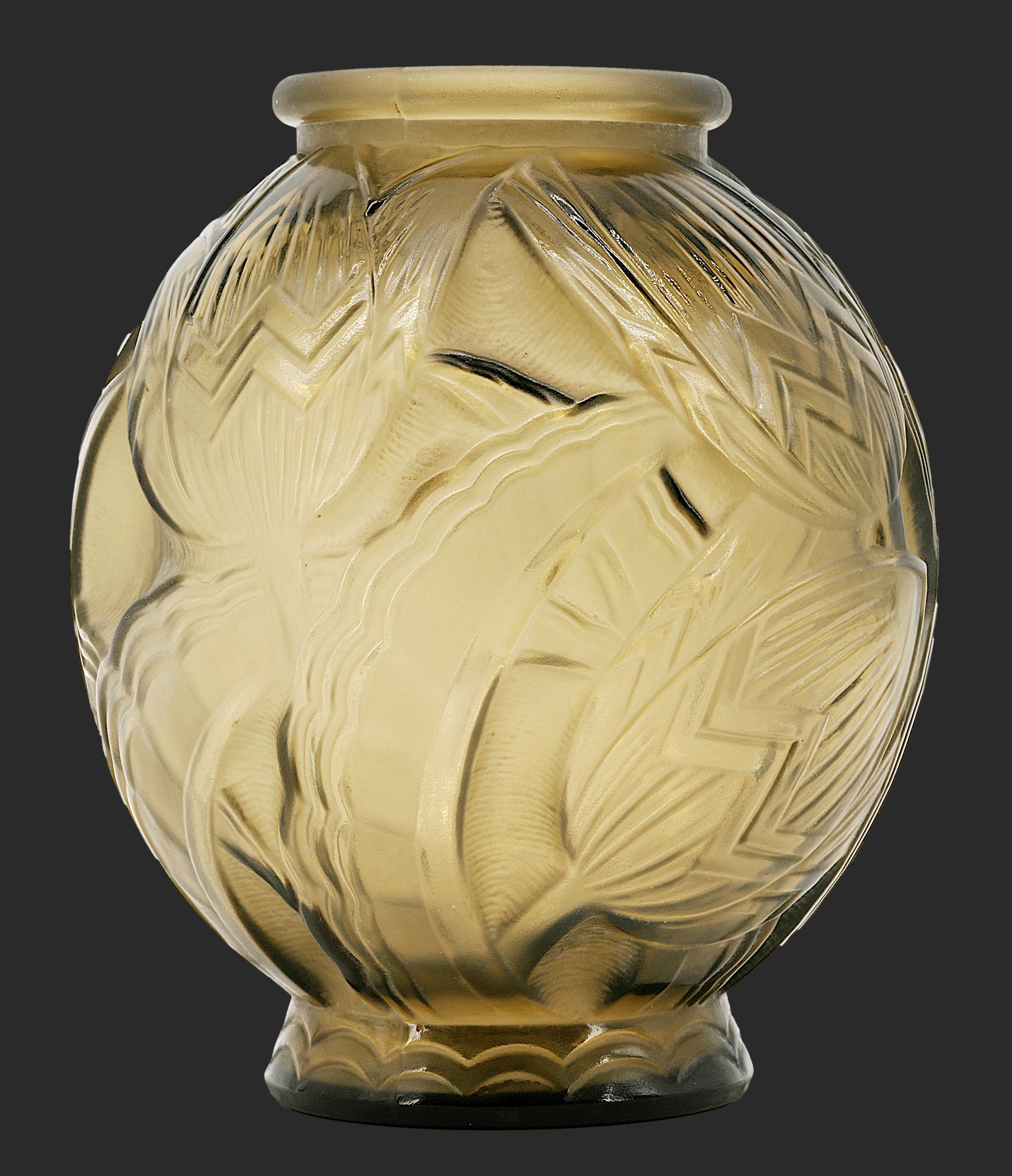 French Art Deco vase by PIERRE D'AVESN, France, ca.1920. Frosted molded glass with a flower pattern. Brown/green color. Purple reflects under the light. Height: 7.9