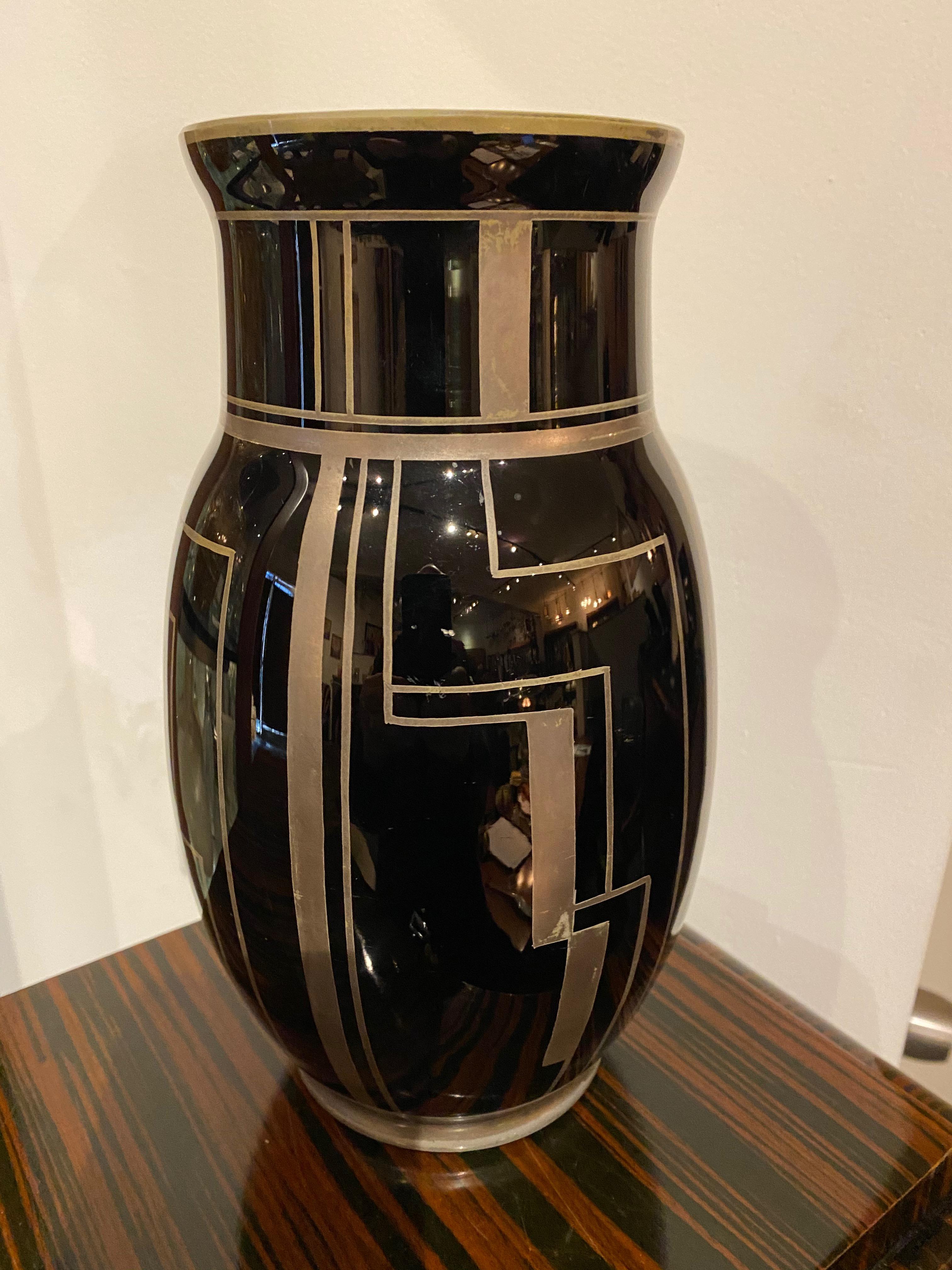 Pierre D’Avesn modernist art glass from Lorrain. Black glass with silver enamel geometric and modern shapes, a very rare art glass vase.

Pierre D’Avesn (born Pierre Gire) went to work for Rene Lalique as an apprentice at the age of 14 and stayed