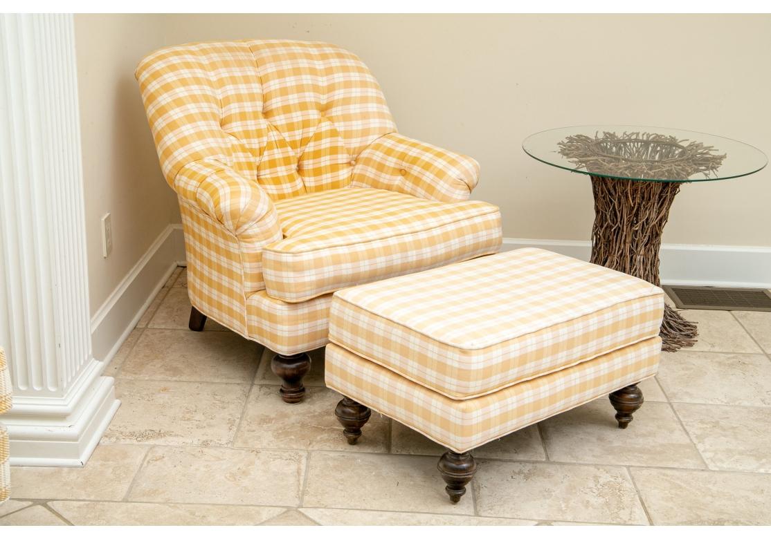Country French Chair and Ottoman with good size and great comfort. Pierre Deux upholstered lounge chair with deep button tufted back, plump gathered arms, bold turned front legs and splayed back legs. The matching ottoman with turned