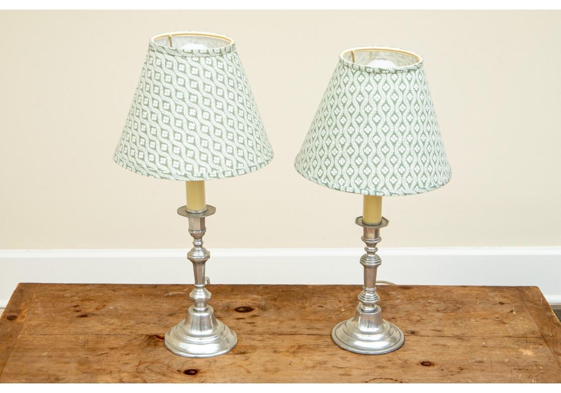 Pair of pewter candlestick lamps by Pierre Deux with sage fabric covered uno hardback shades.
Dimensions: 5