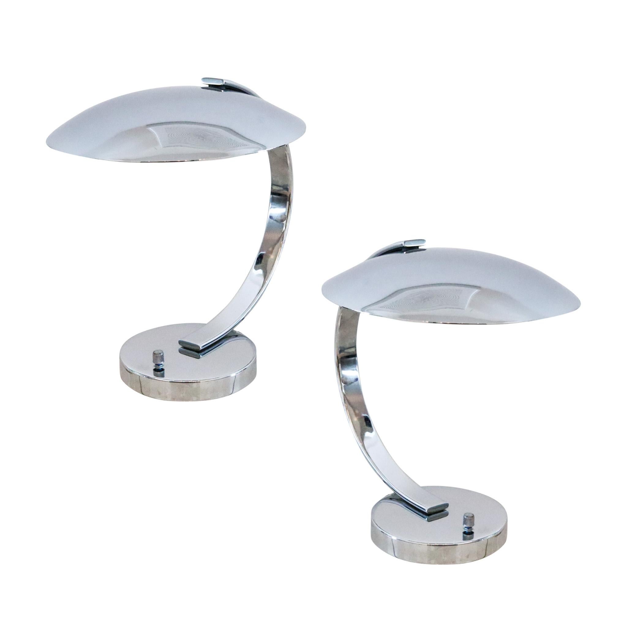 Pair of desk lamps designed by Pierre Disderot.

Beautiful aerodynamic modern pair of desk lamps, created in Paris France by the company of Pierre Disderot, back in the 1980. These are the model 6183, with incorporated light dimmer and crafted in