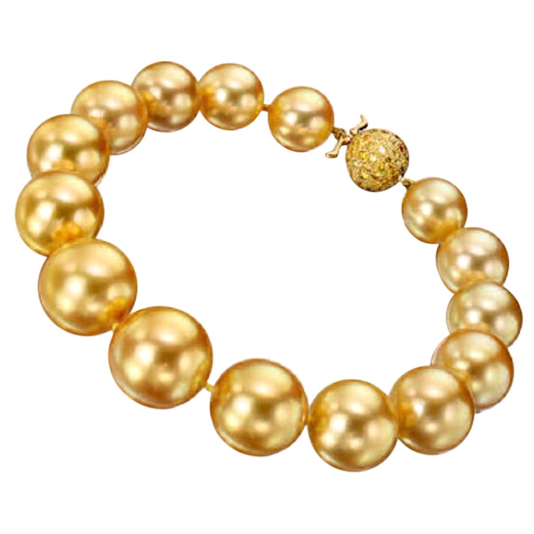 15 true gem natural - not dyed - color, deep golden South Sea pearls slightly graduating in size, from 10.5 up to 14.35 mm.  The color is a vibrant deep gold color, the skins are clean with fine deep luster and these spherical pearls are well