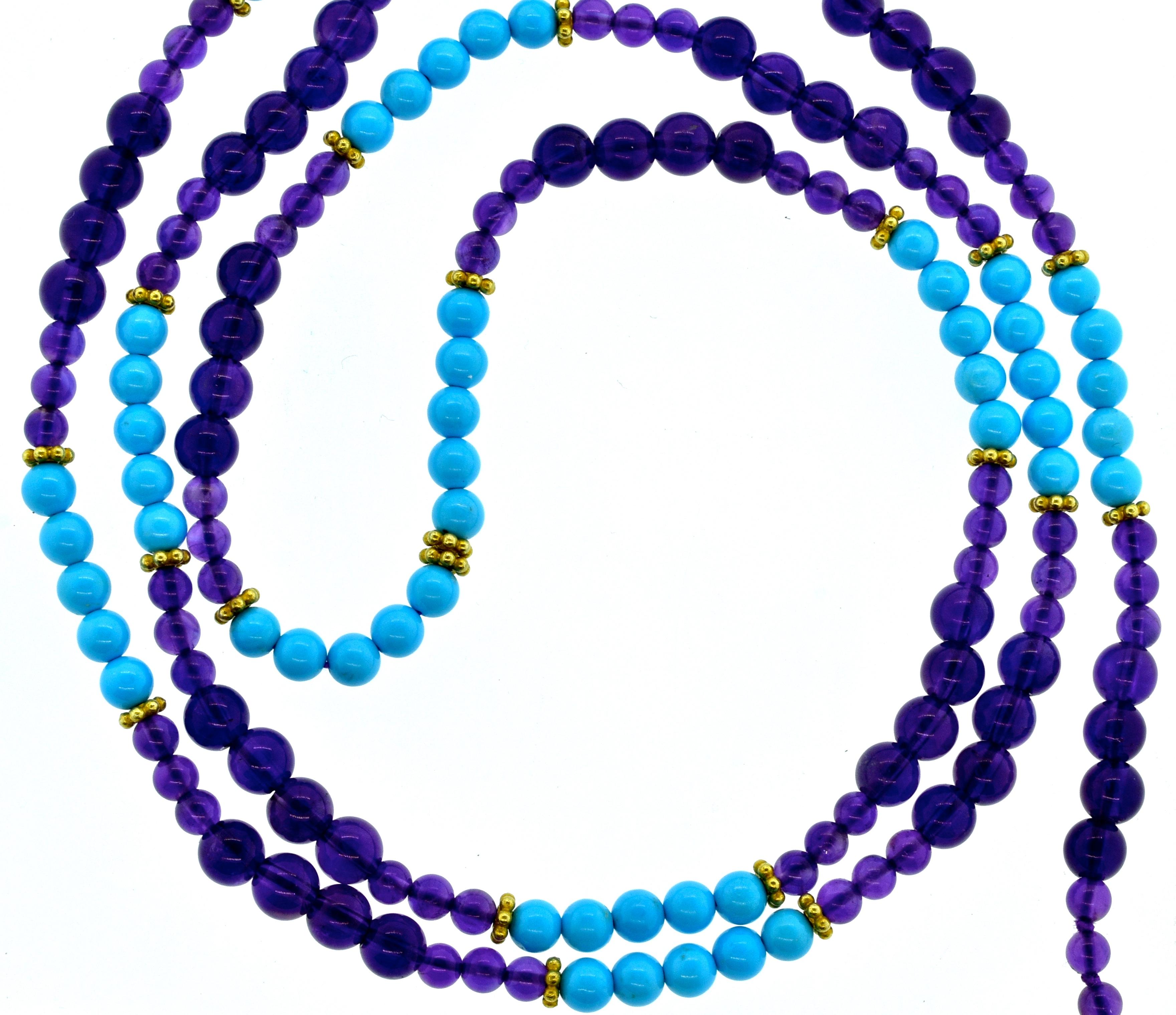 Amethyst beads, deep purple in color, are interspersed with bright Robin's egg blue turquoise.  These natural stones range in size from 4.4 mm up to 6.3 mm.  There are 14K gold roundels set throughout.  This necklace is 36 inches long and new by
