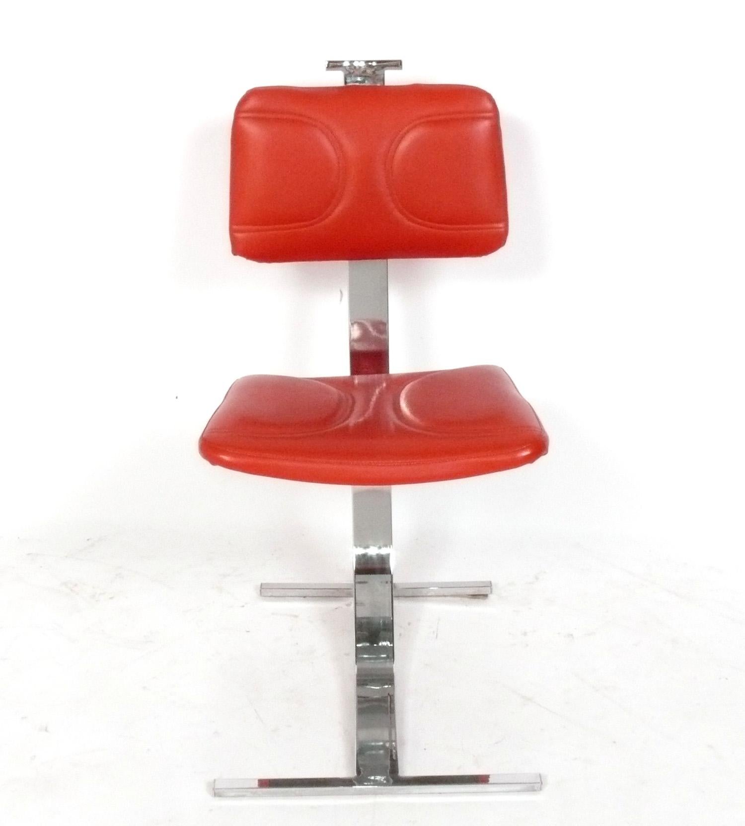Set of Eight Sculptural Mid Century Modern Dining Chairs, designed by Pierre Folie, France, circa 1970s. They retain their original vibrant red vinyl upholstery. If you would prefer them to be reupholstered in your fabric, we can certainly do that