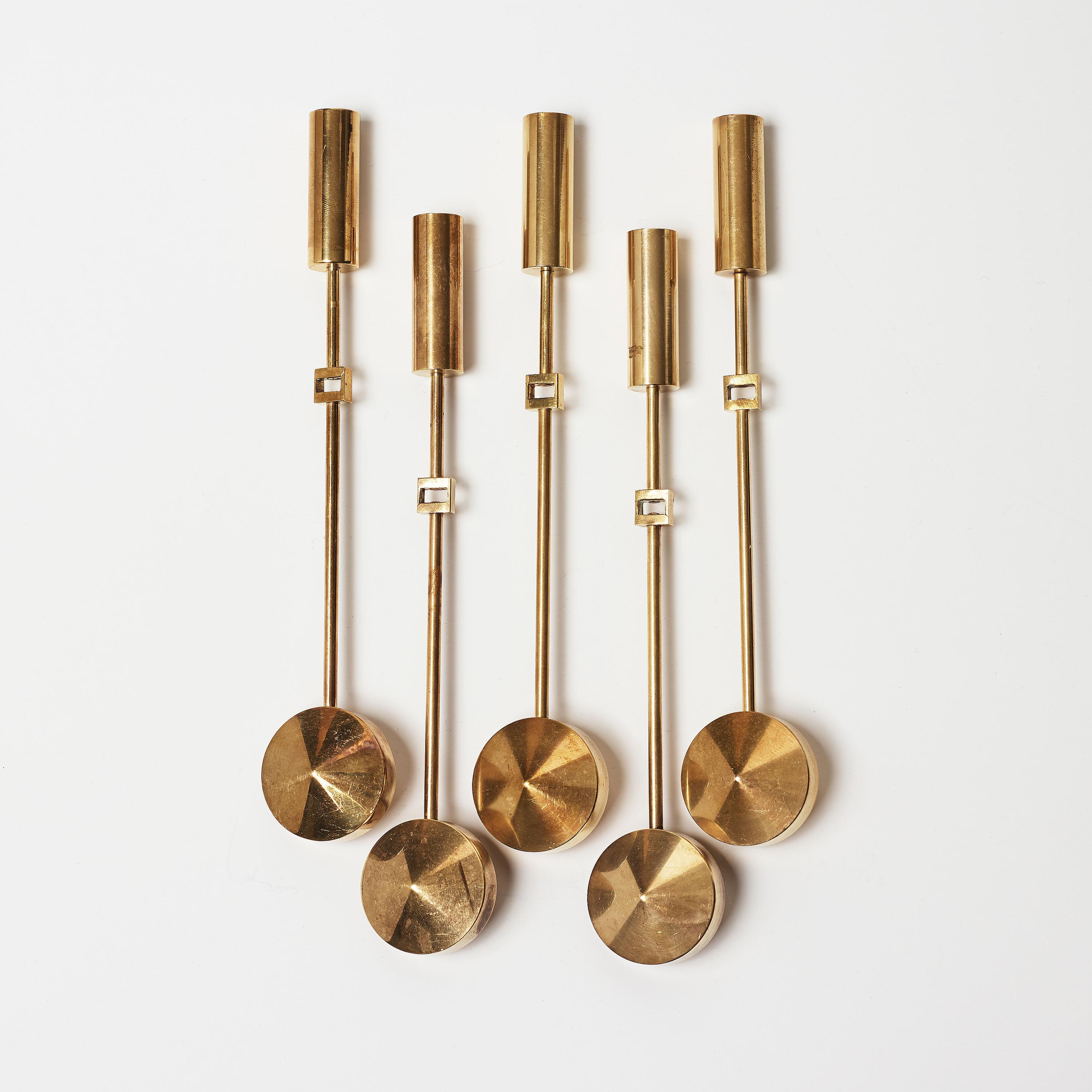  Brass Swedish wall mounted candle holders designed by Pierre Forsell and manufactured by Skultuna, 1955s. Model - Pendal No 71.   
Good Condition 
Serie of 12 pieces price by item
The pendulum weighted candle holder section simply slots onto the