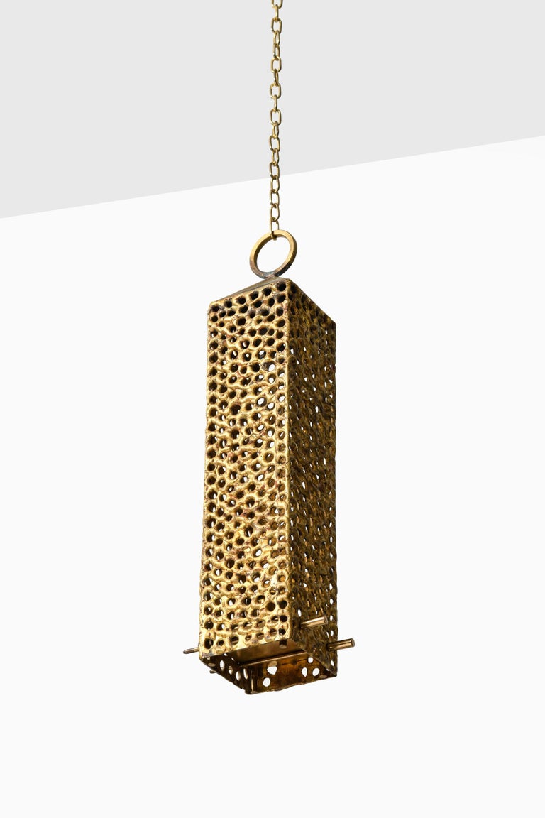 Rare hanging lantern in brass designed by Pierre Forsell. Produced by Skultuna in Sweden.