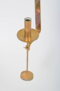 Pierre Forsell, Skultuna. Wall candle holder in brass with pendulum suspension